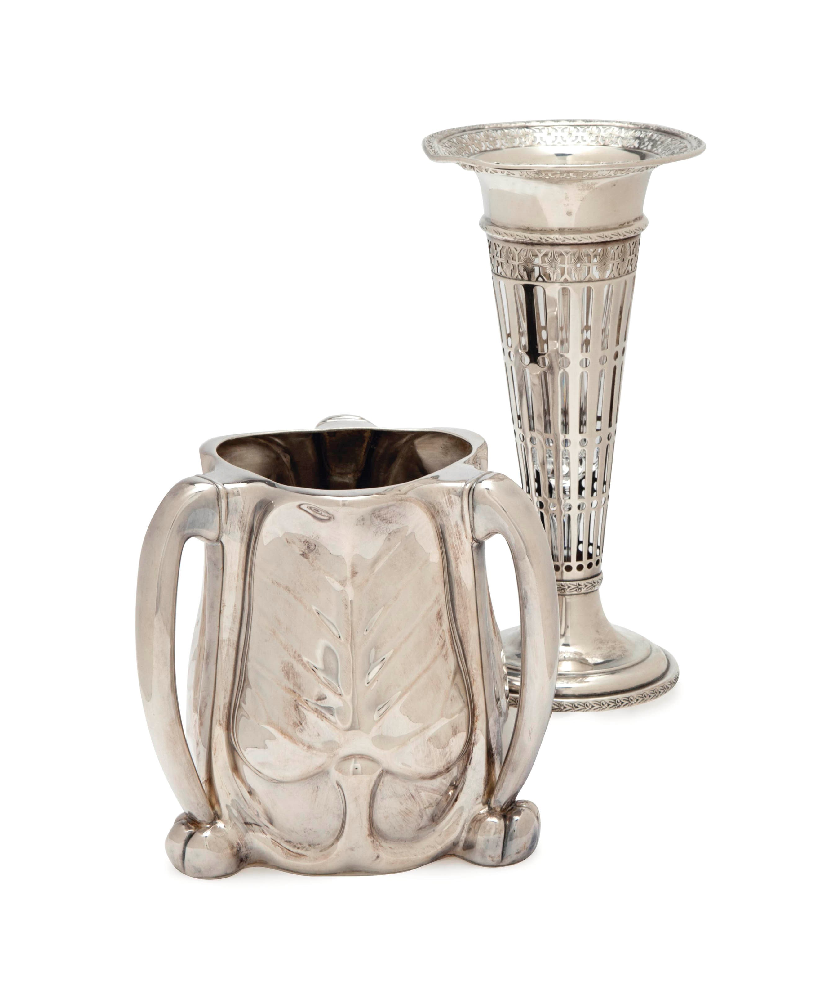 AN AMERICAN SILVER LEAF-FORM THREE-HANDLED LOVING CUP,