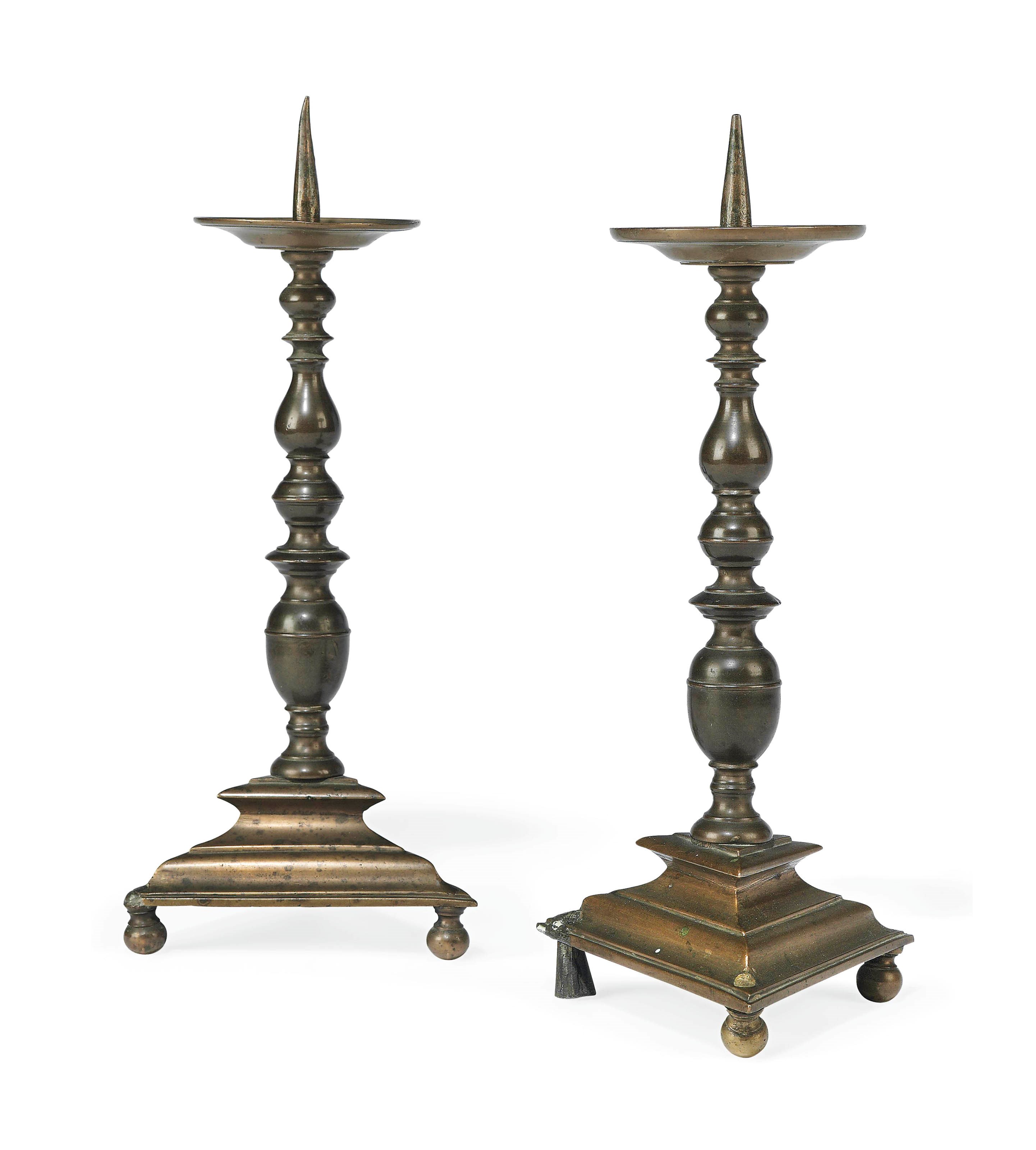 A PAIR OF BRONZE PRICKET-CANDLESTICKS