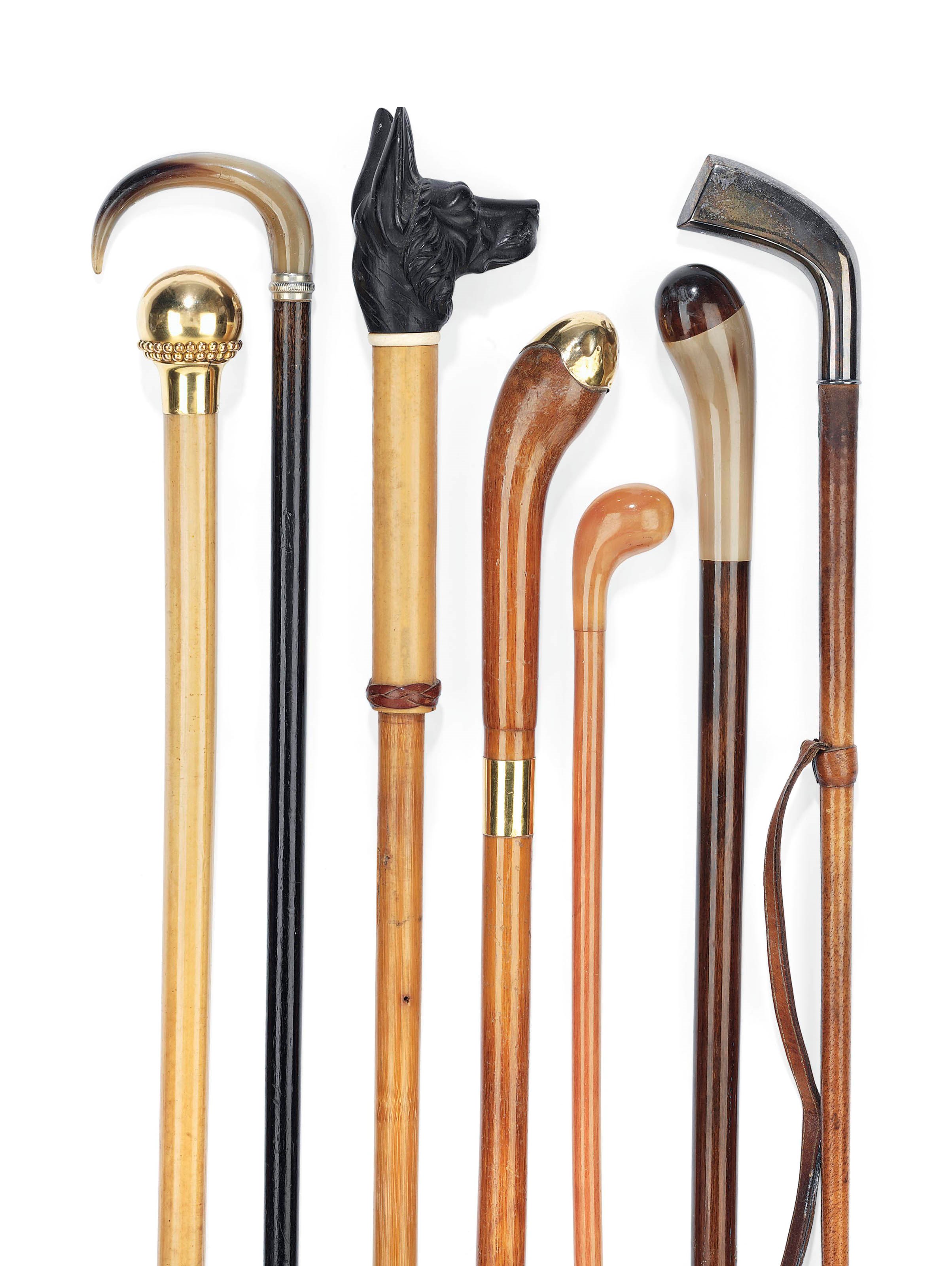 A GROUP OF SIX WALKING STICKS