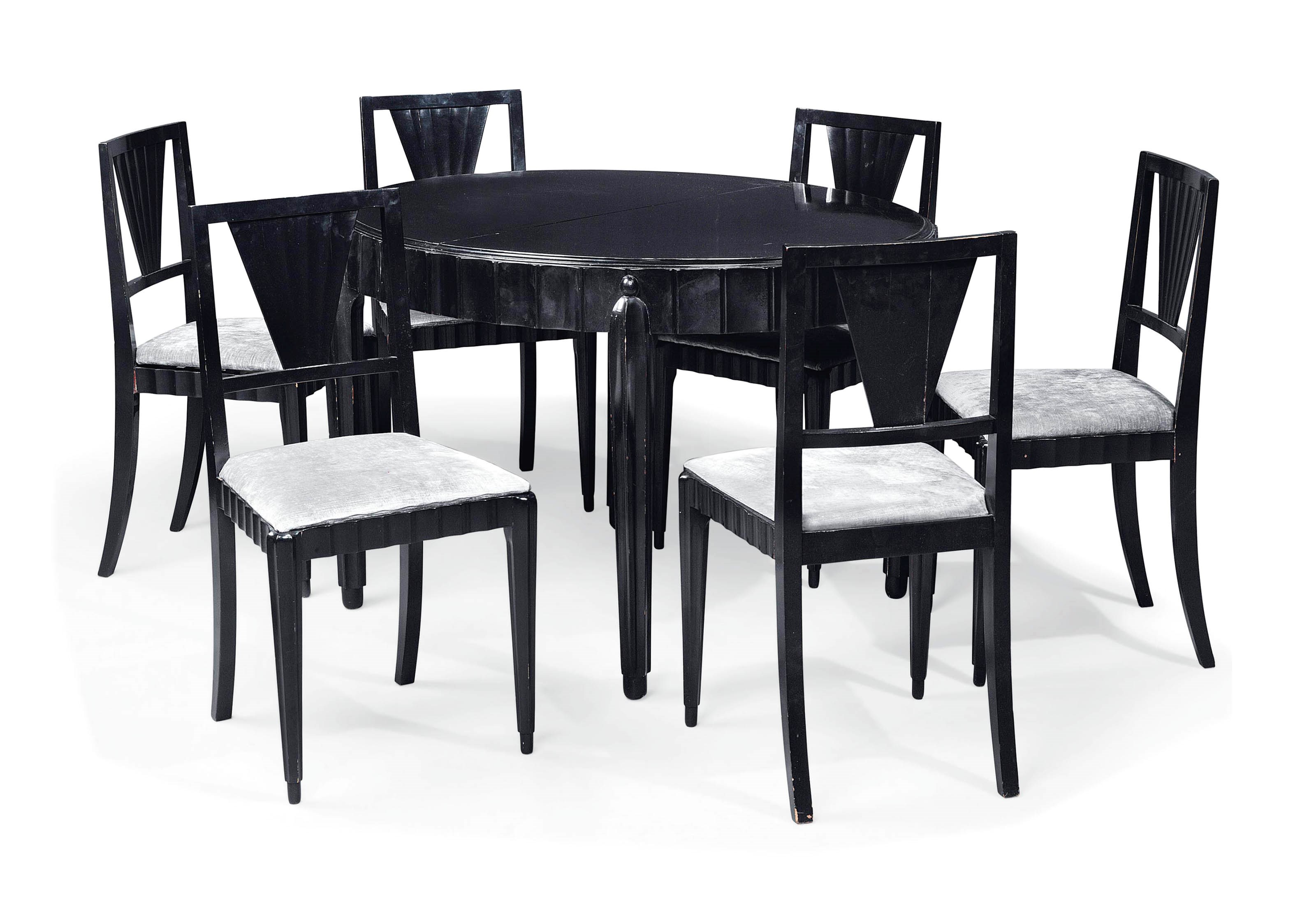 AN EBONISED DINING TABLE AND SIX CHAIRS