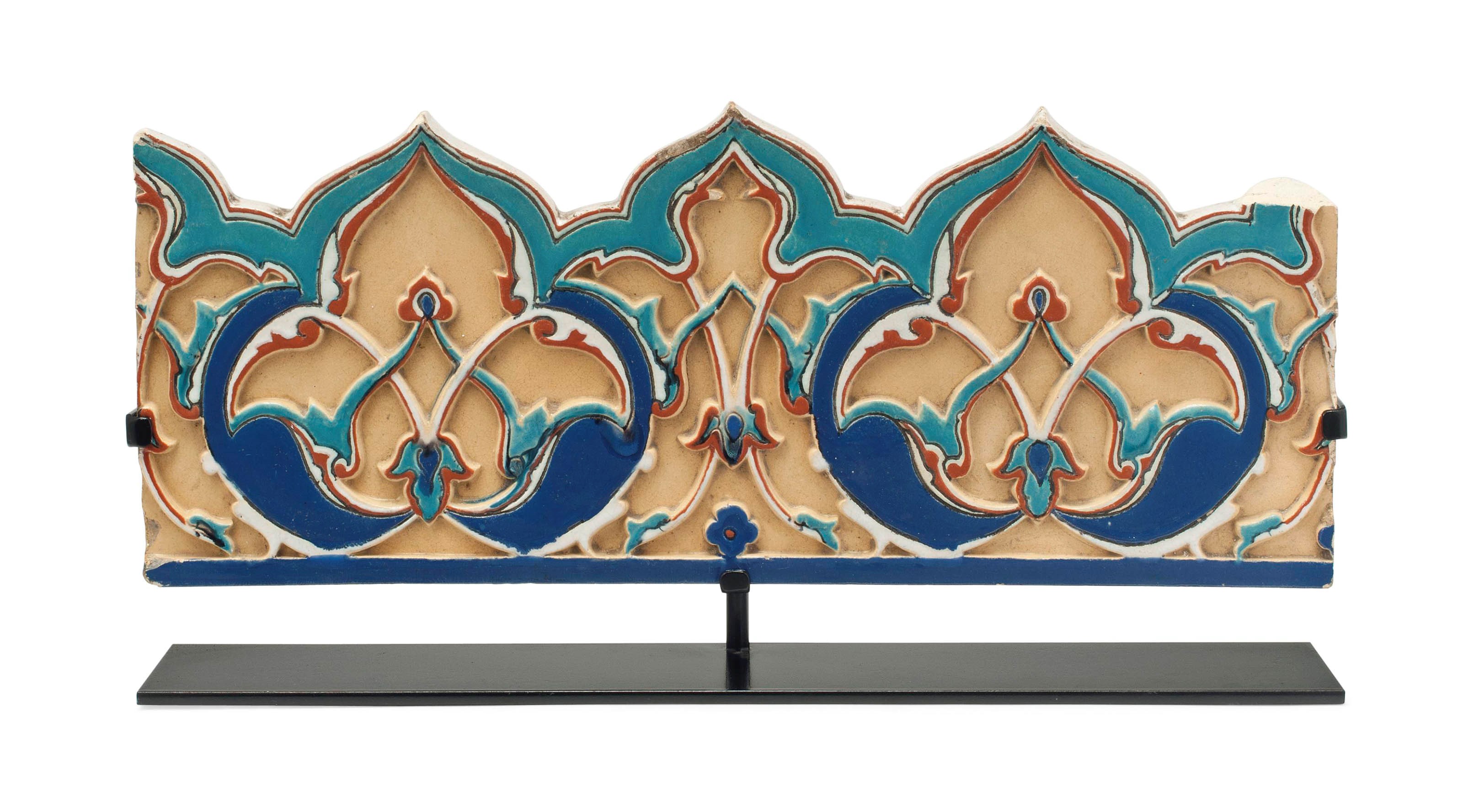 A CORNICE MOULDED POTTERY TILE