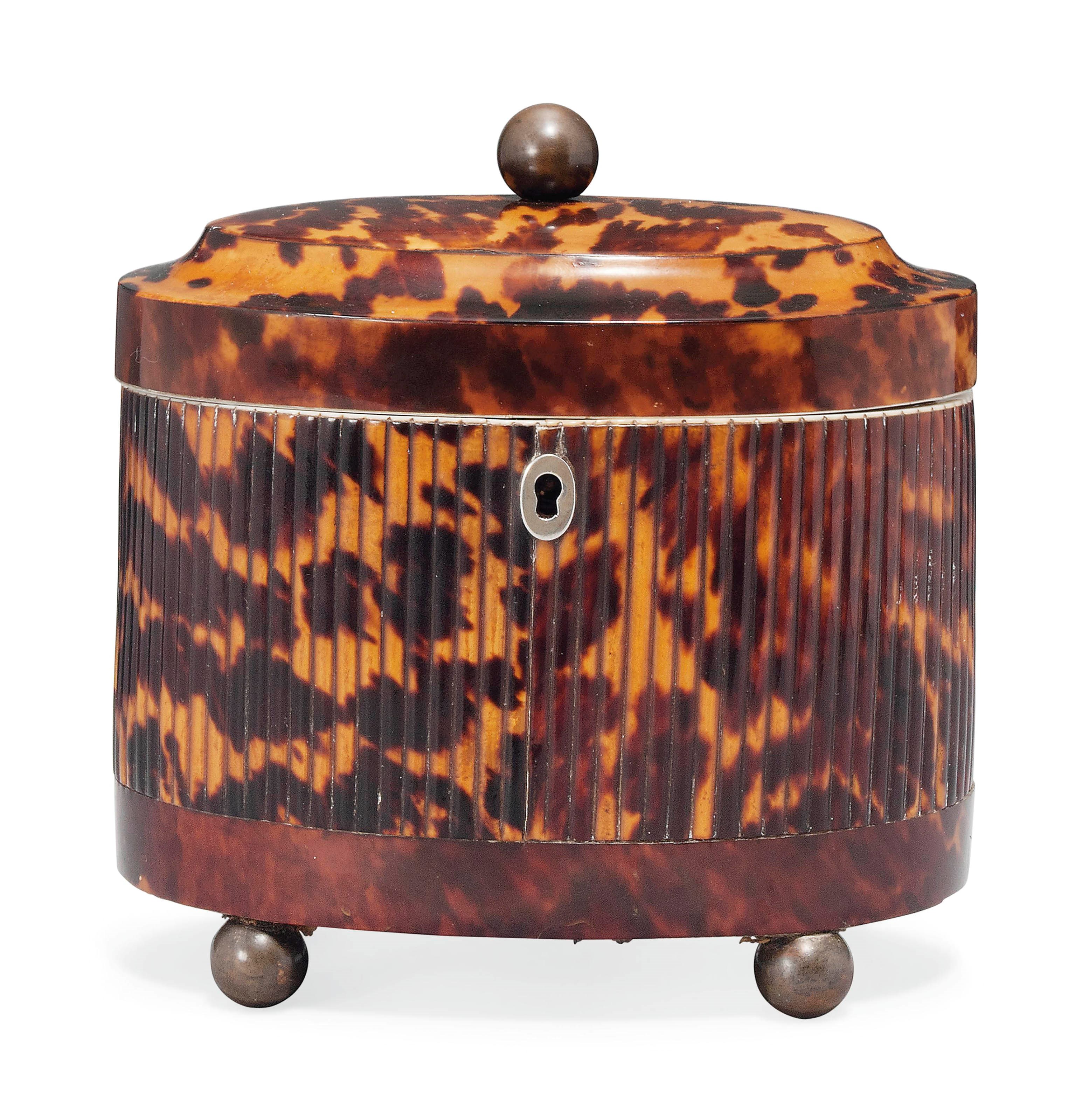 A GEORGE III OVAL TORTOISESHELL TEA CADDY