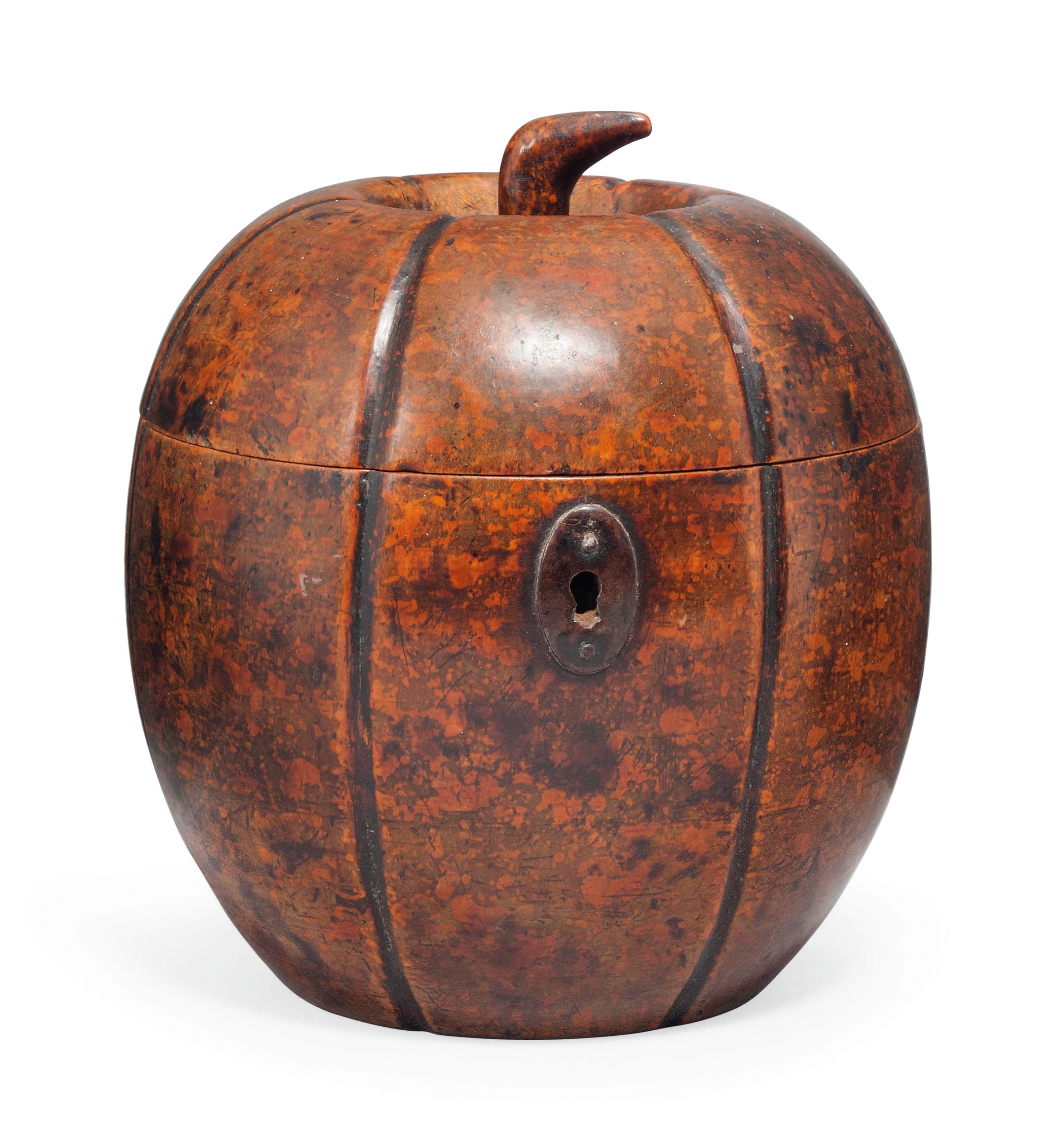 A GEORGE III FRUITWOOD MELON SHAPED TEA CADDY