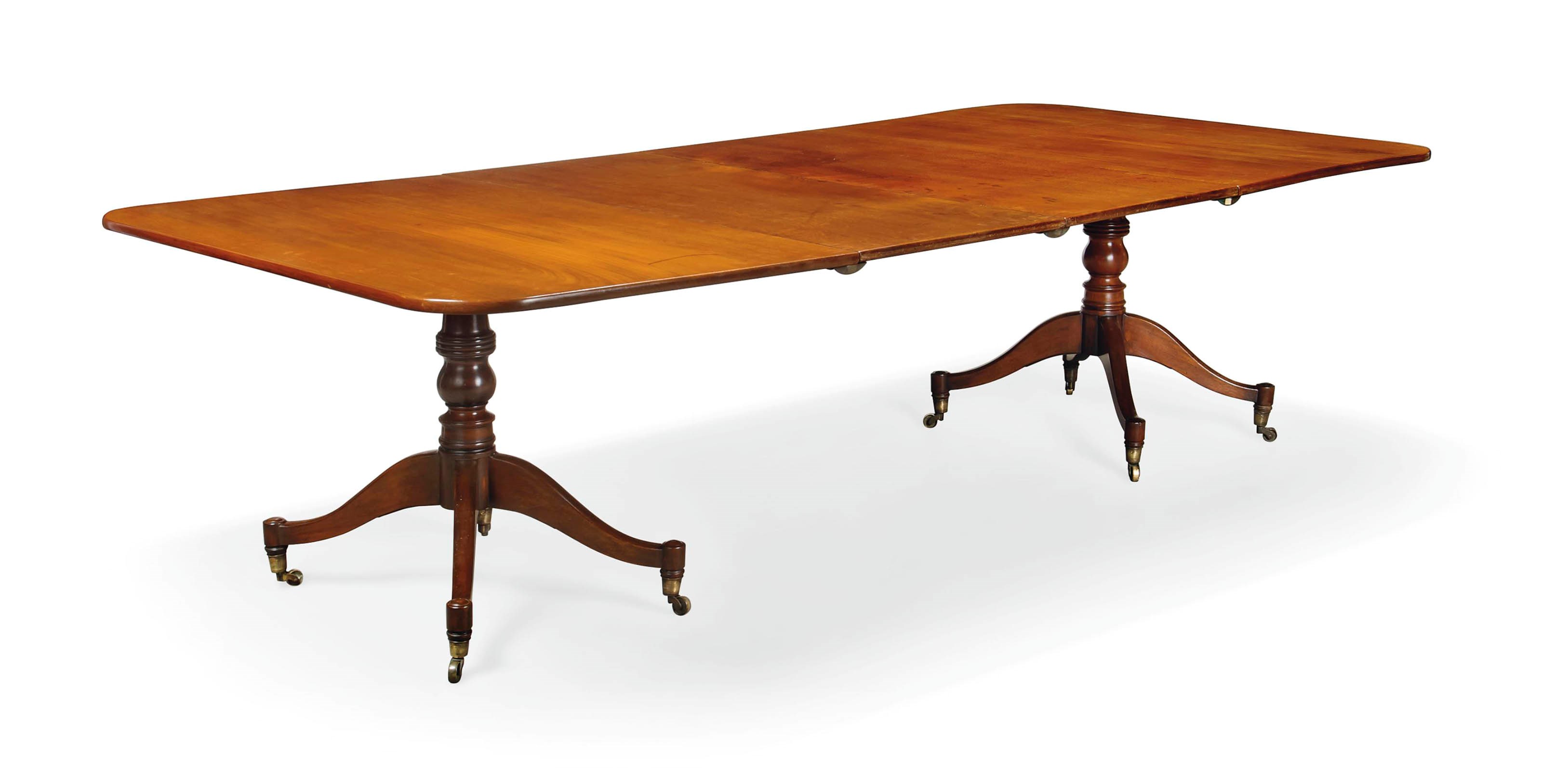 A MAHOGANY TWIN PEDESTAL DINING TABLE