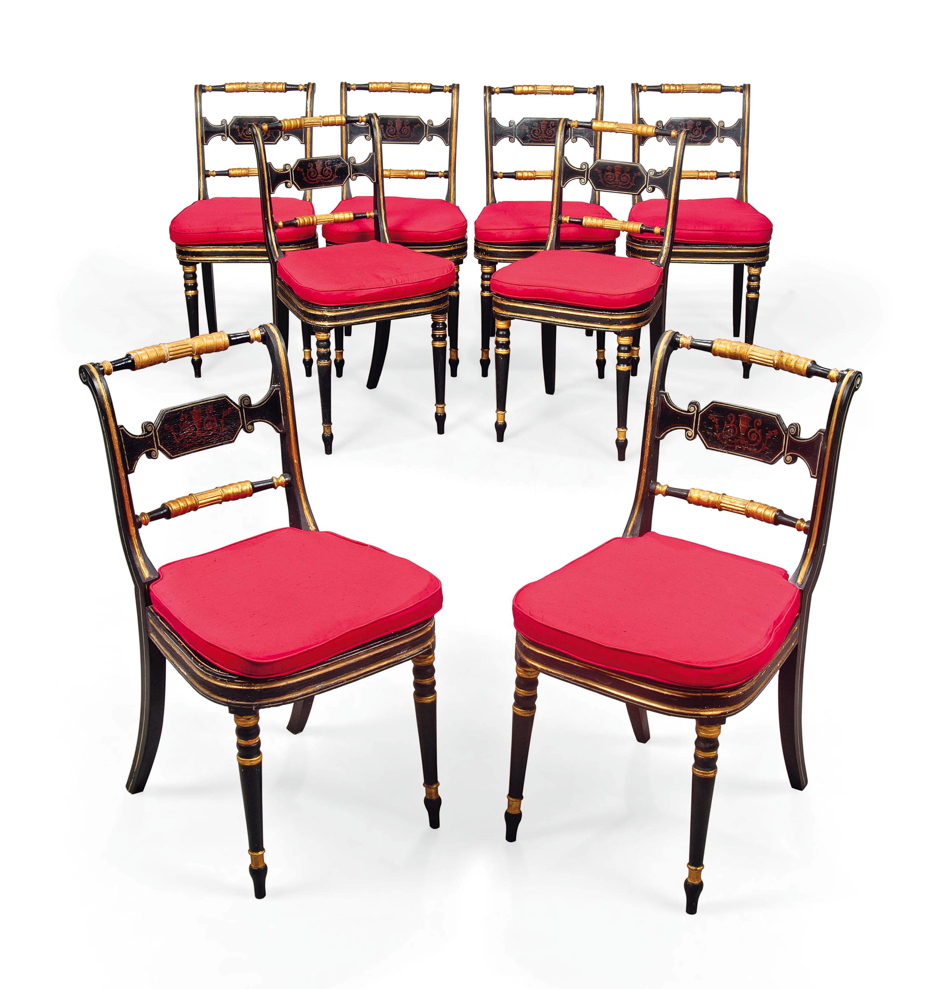 A SET OF EIGHT REGENCY PARCEL-GILT EBONISED DINING CHAIRS
