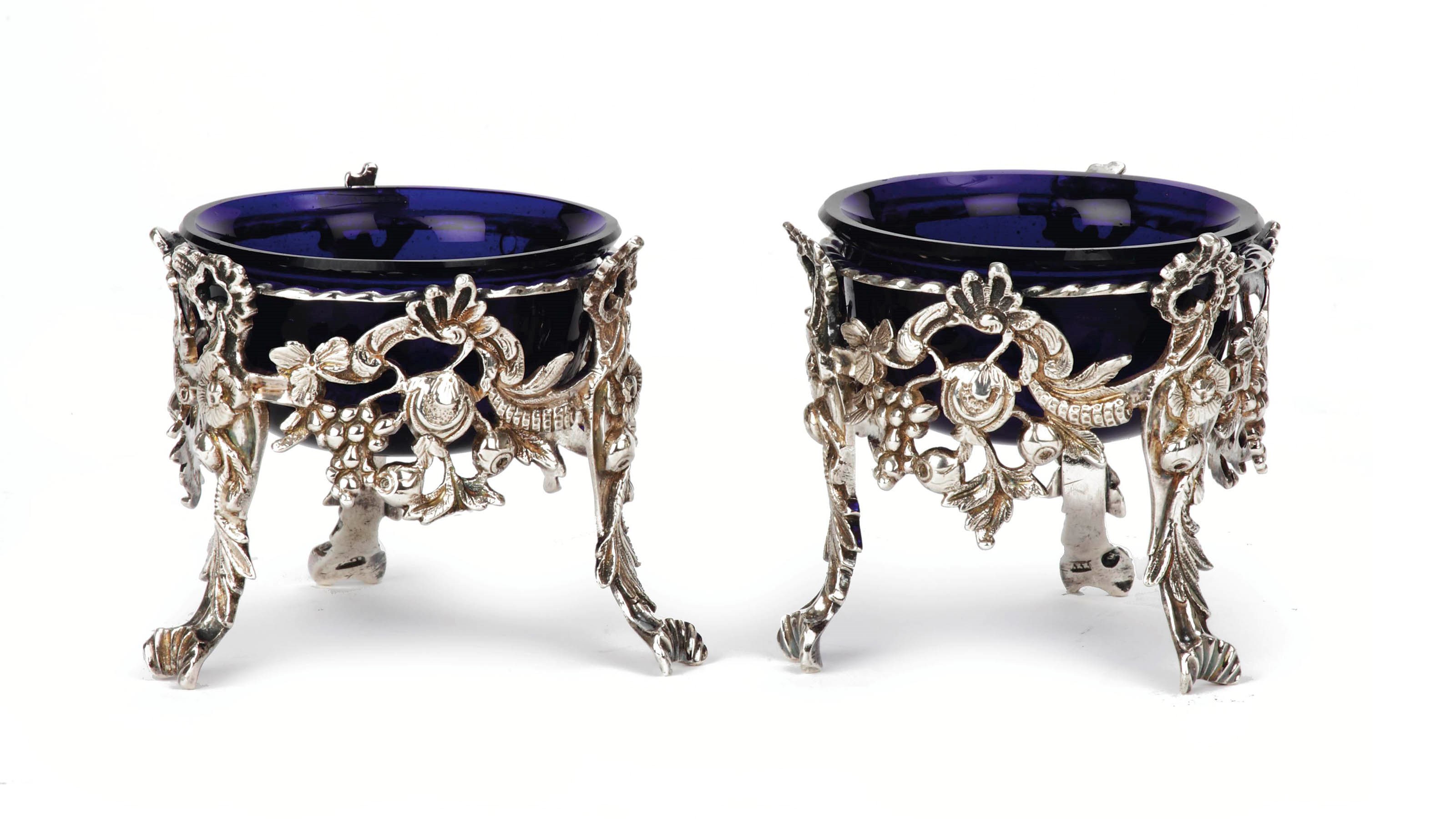 A pair of Dutch silver salt cellars and blue glass liners