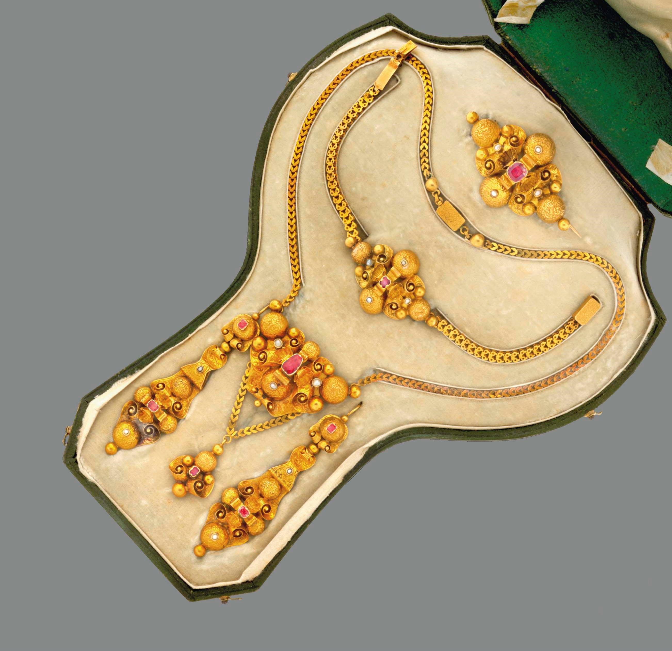 A mid 19th century ruby and seed pearl-set gold parure