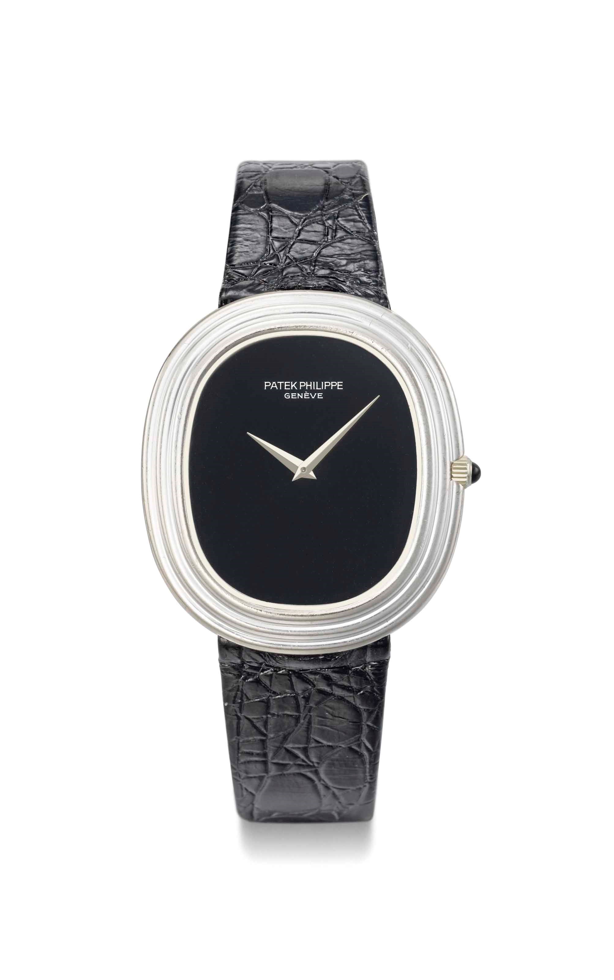 Patek Philippe. An 18K white gold oval automatic wristwatch with onyx dial