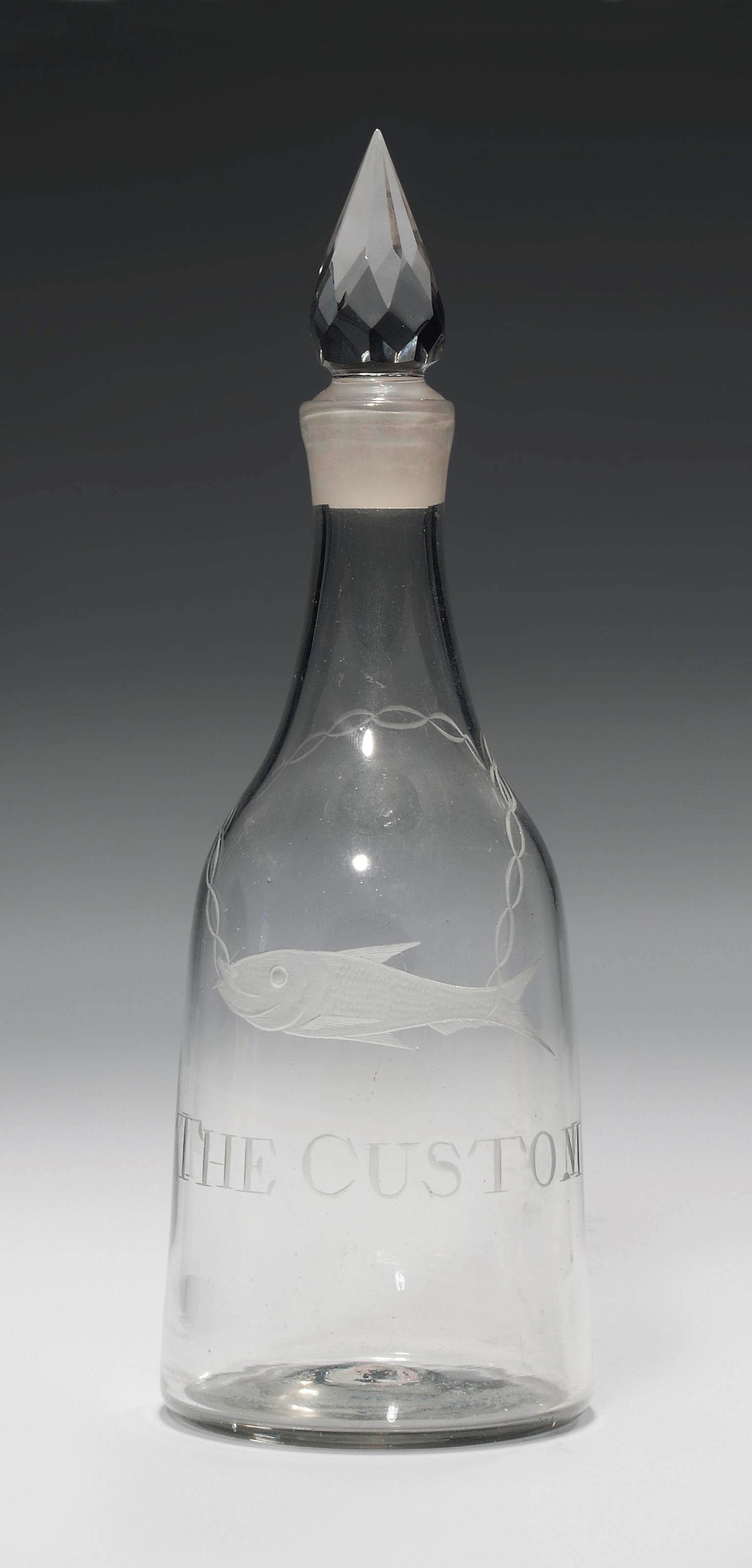 AN ENGRAVED GLASS SPIRIT DECANTER AND STOPPER