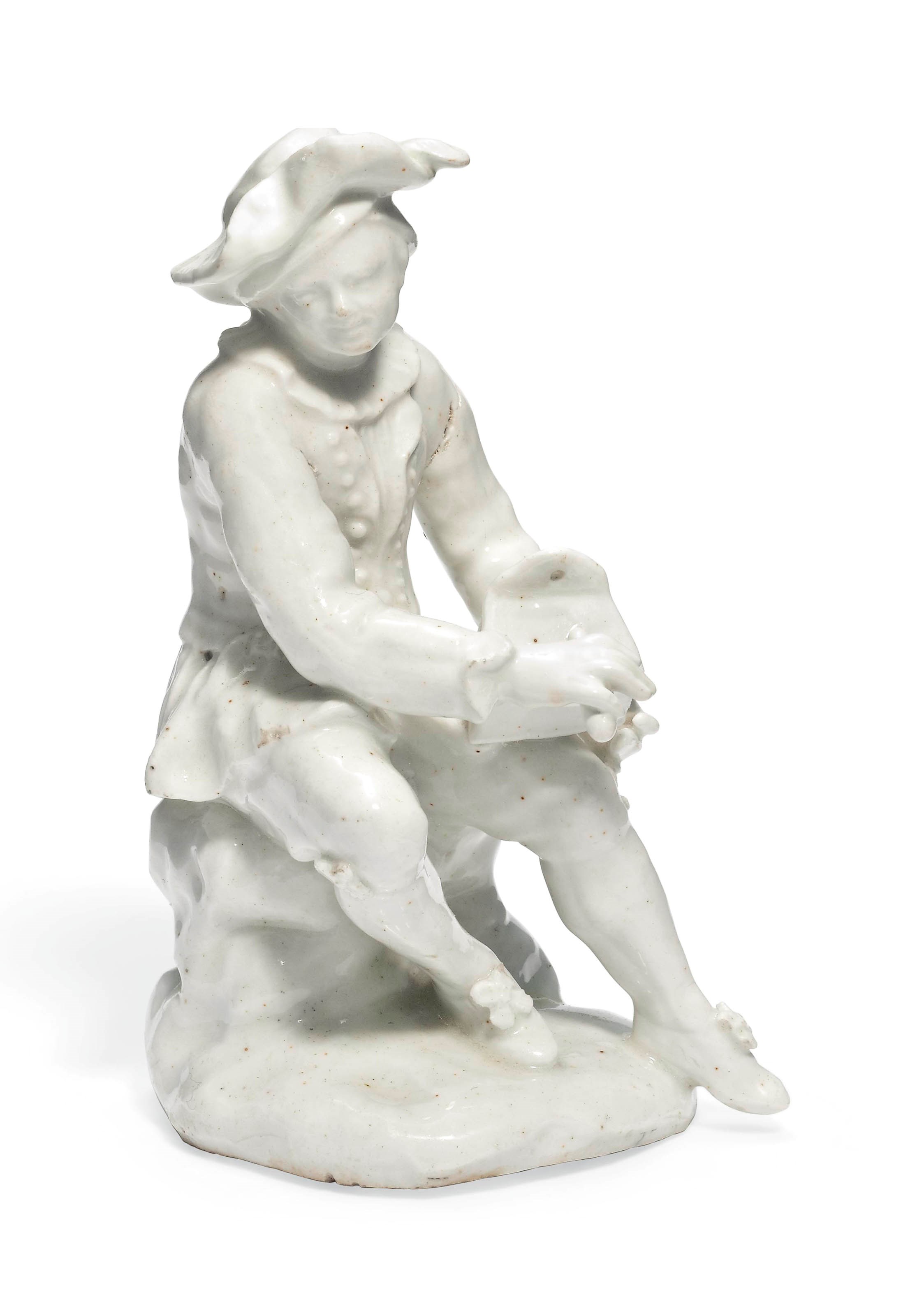 A BOW WHITE FIGURE OF A SALTBOX PLAYER