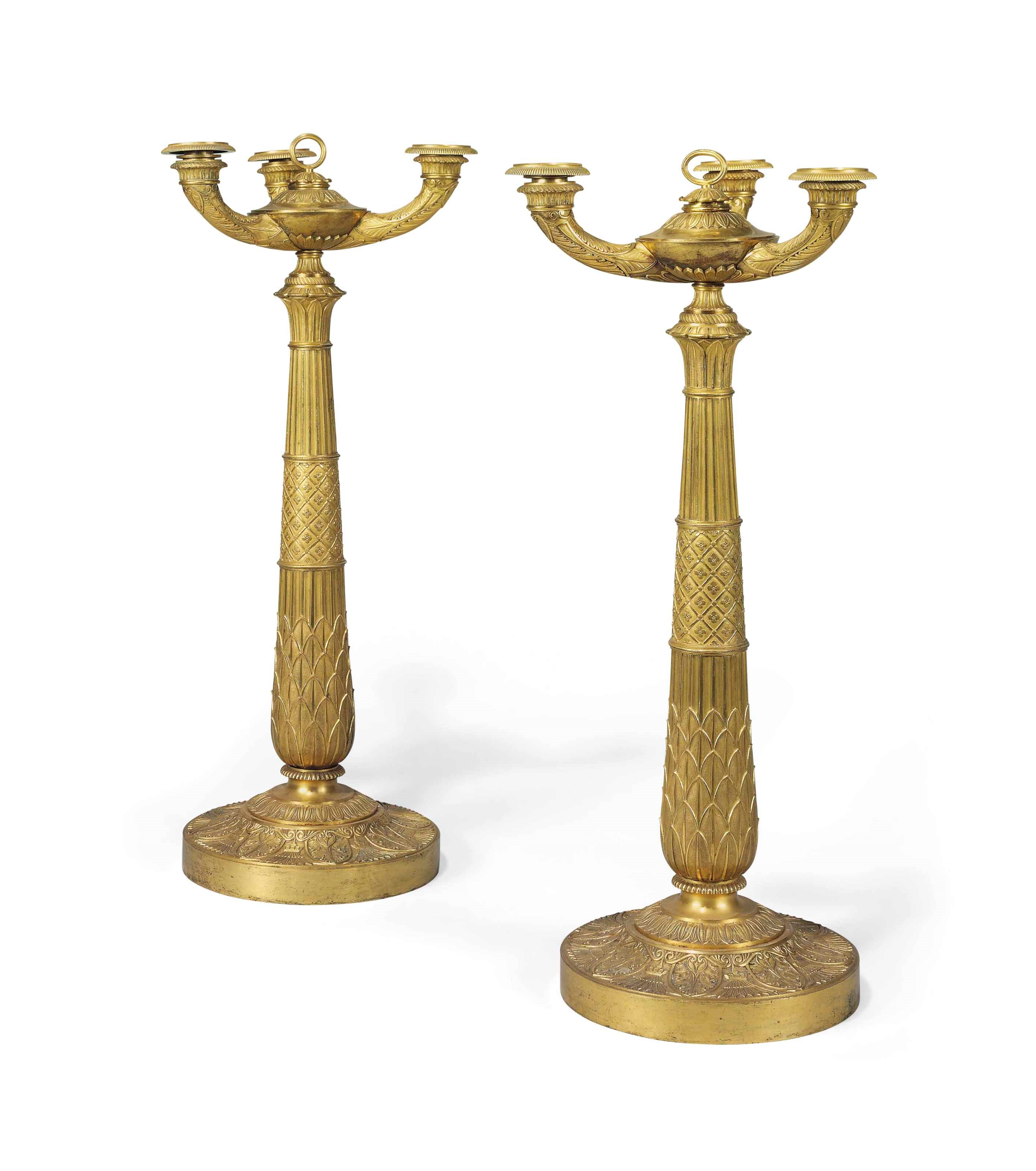 A PAIR OF CONSULAT ORMOLU FOUR-LIGHT CANDELABRA