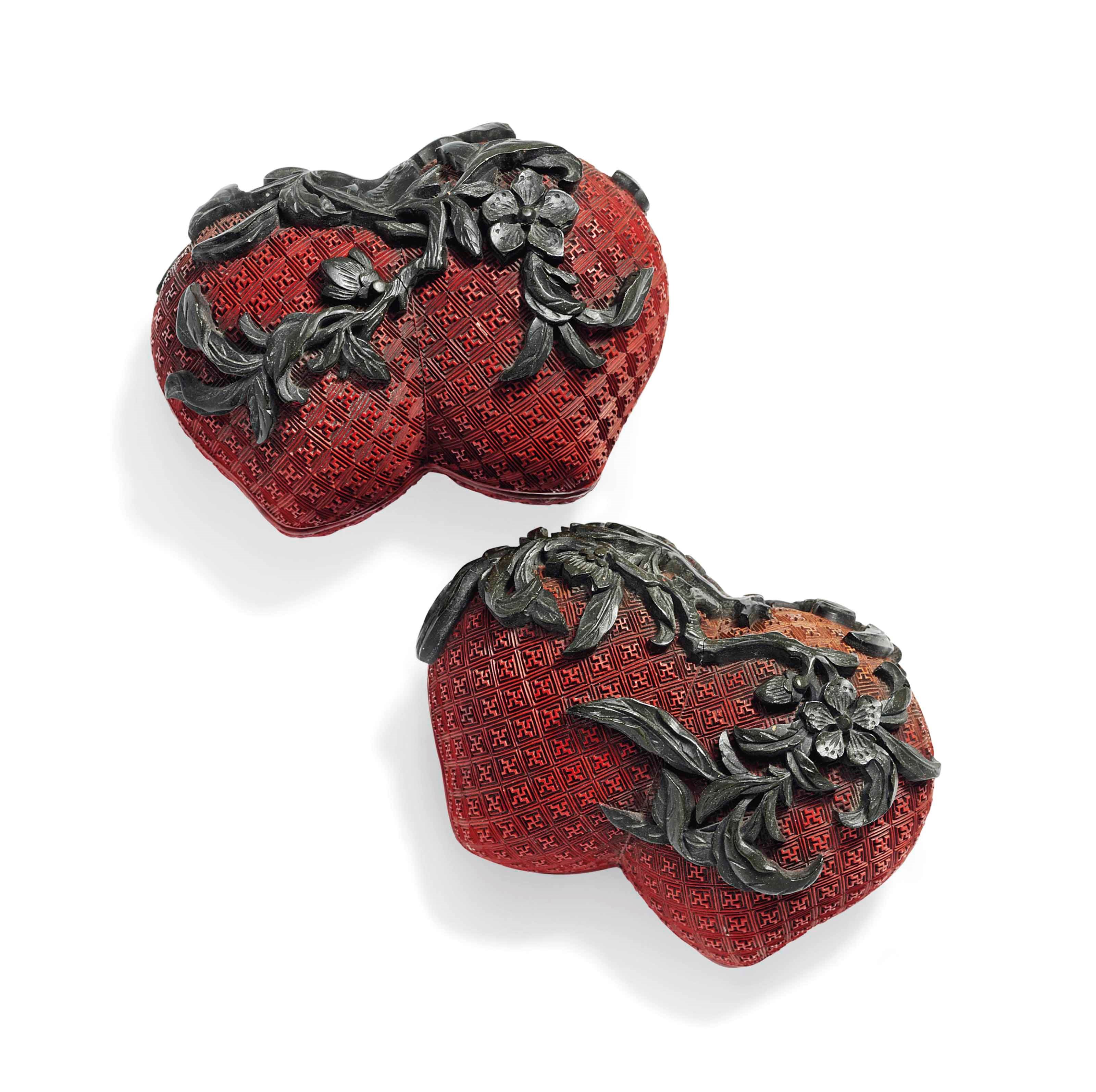 A PAIR OF CHINESE TWO-COLOUR LACQUER 'DOUBLE PEACH' BOXES AND COVERS