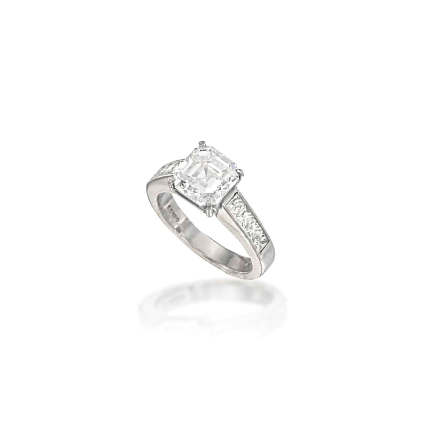 A PLATINUM AND DIAMOND SINGLE-STONE RING