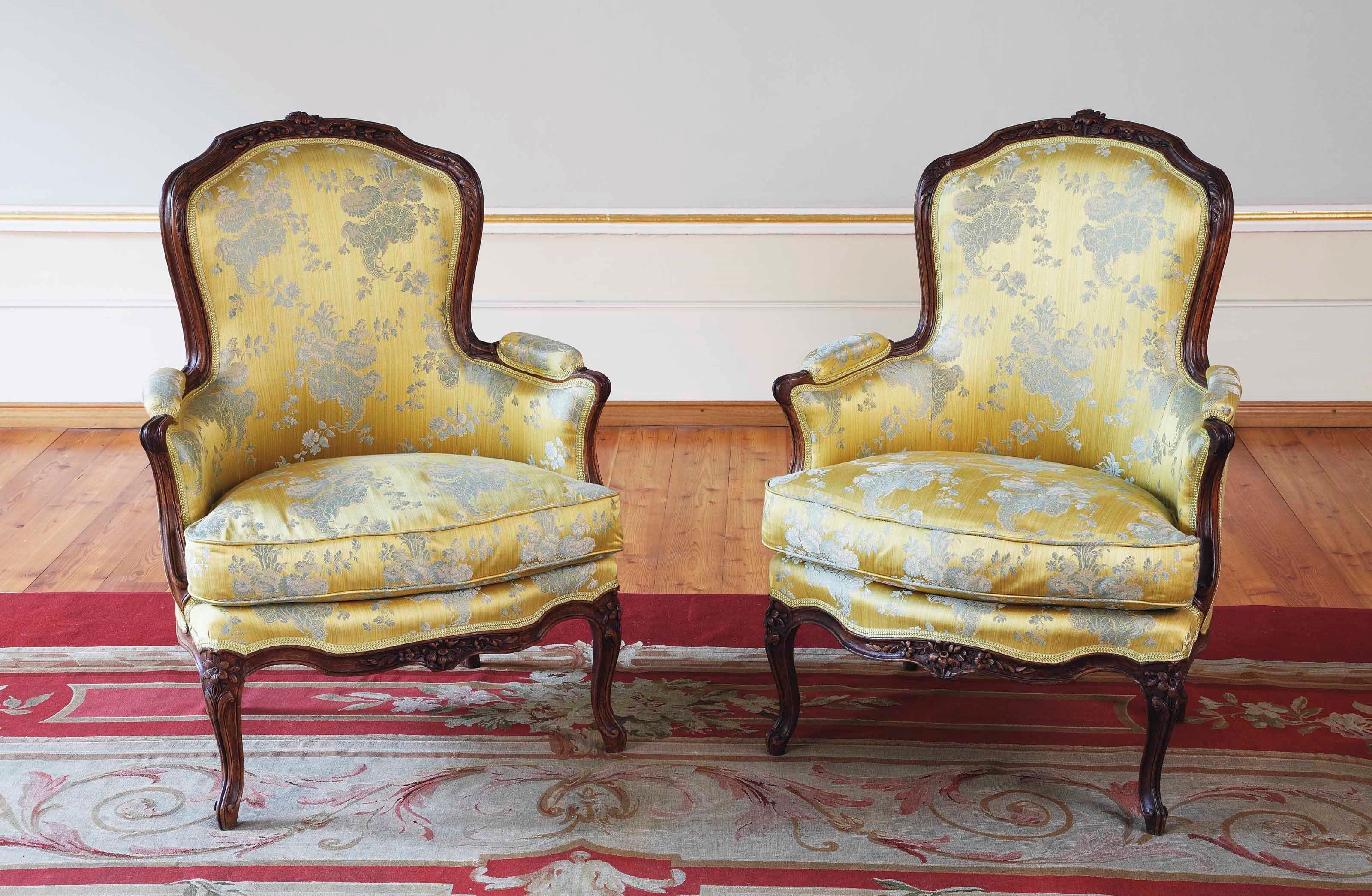 A PAIR OF LOUIS XV WALNUT BERGERES
