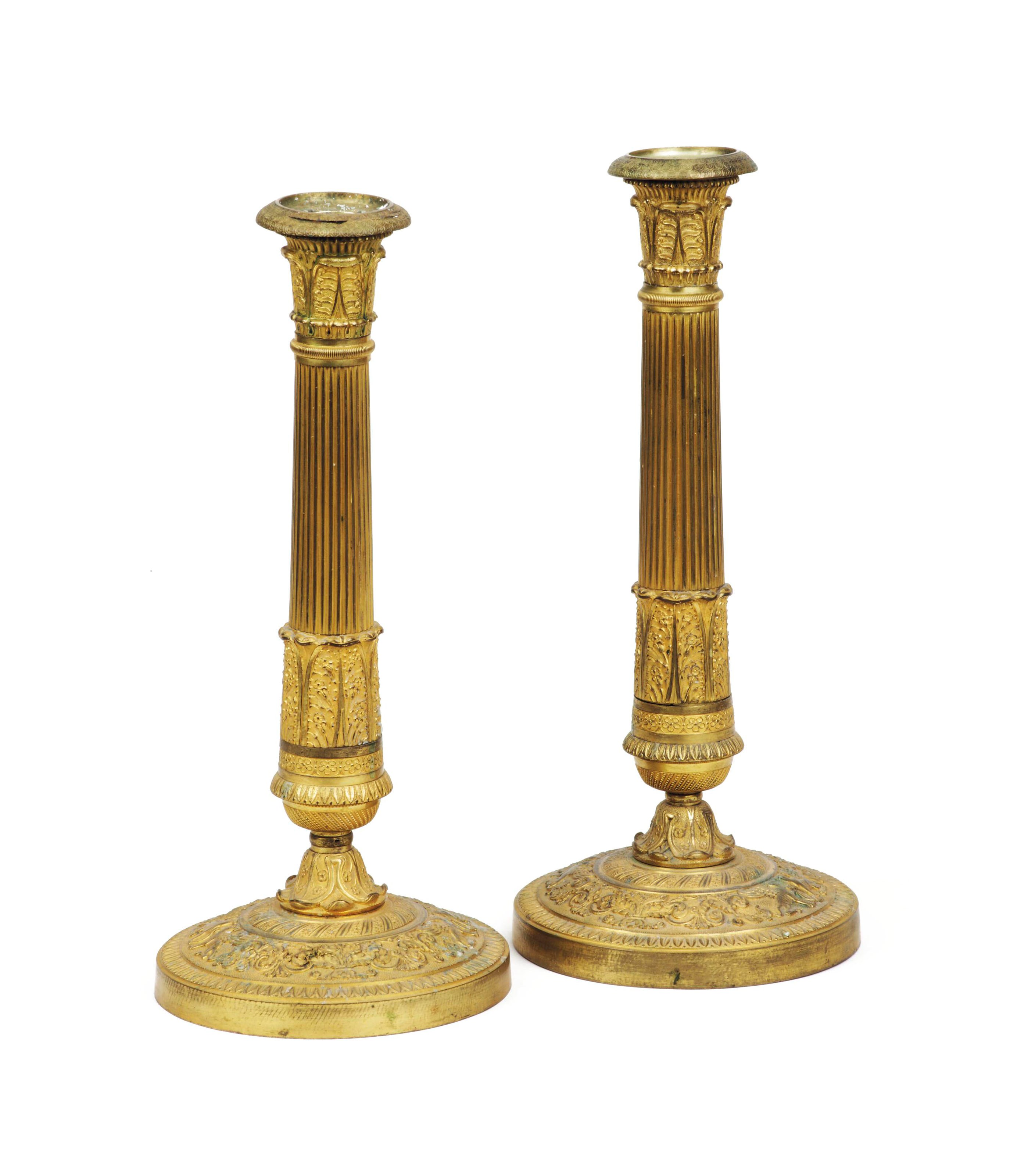 A PAIR OF EMPIRE ORMOLU CANDLESTICKS