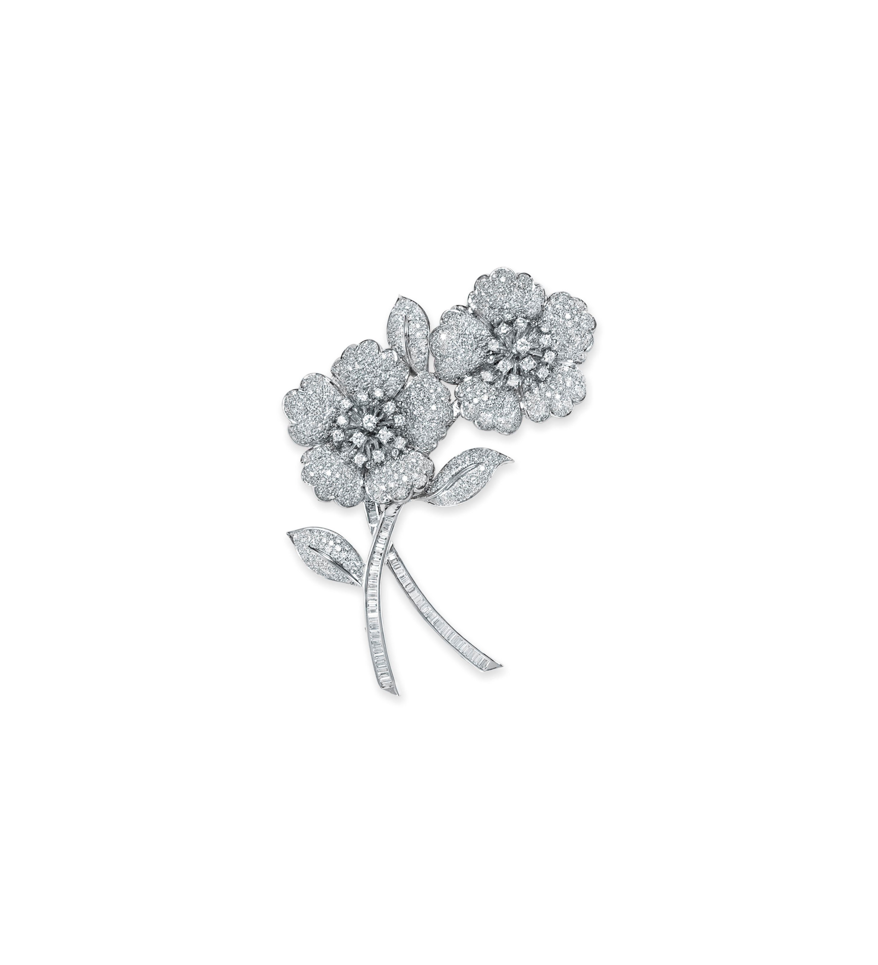 A DIAMOND FLOWER BROOCH