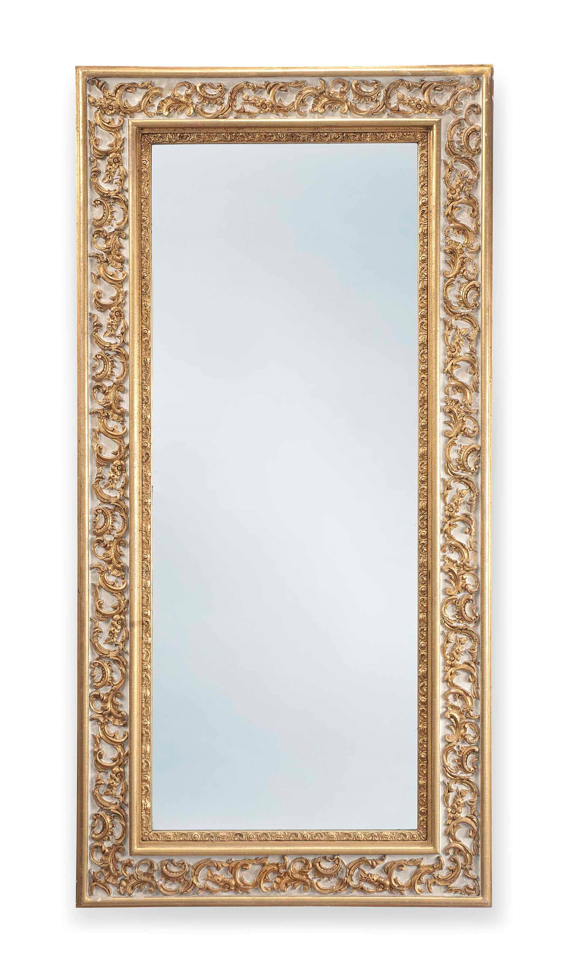 A NORTH EUROPEAN WHITE PAINTED AND PARCEL GILT MIRROR