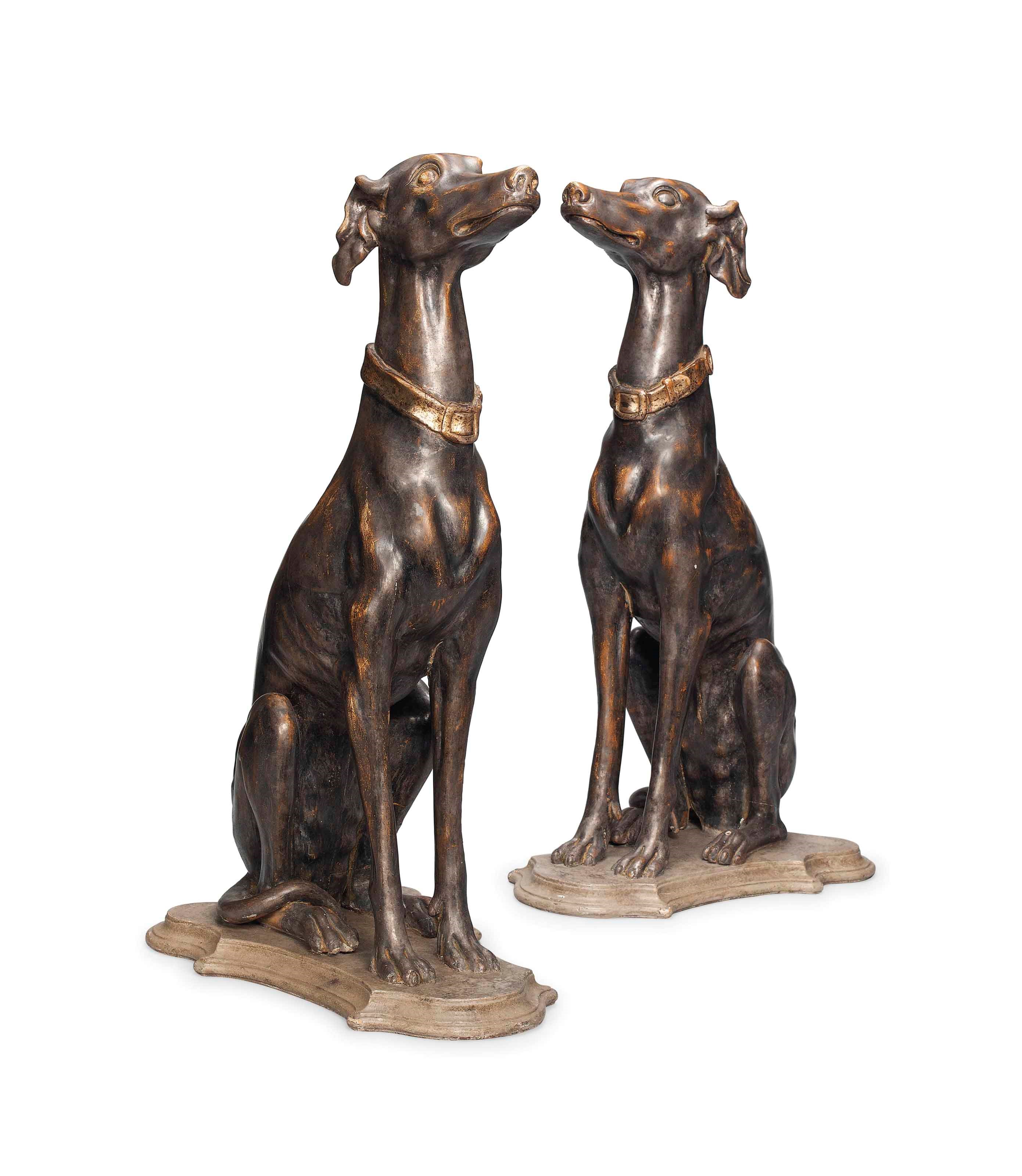 TWO PARCEL-GILT WOOD MODELS OF GREYHOUNDS