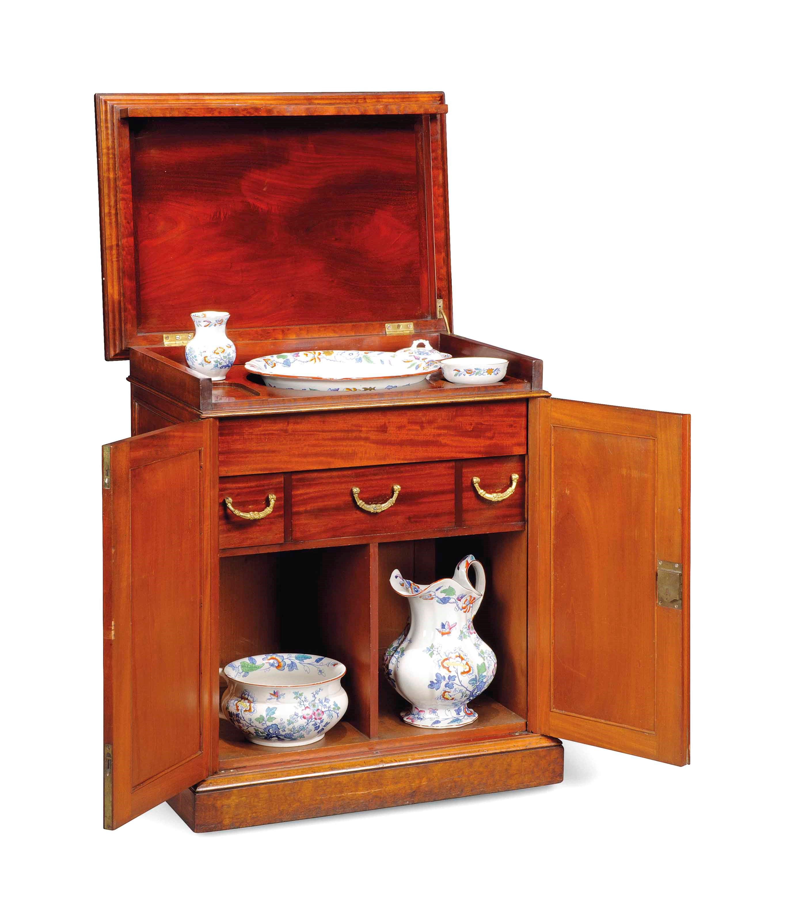 A ROYAL VICTORIAN PLUM-PUDDING MAHOGANY WASH STAND