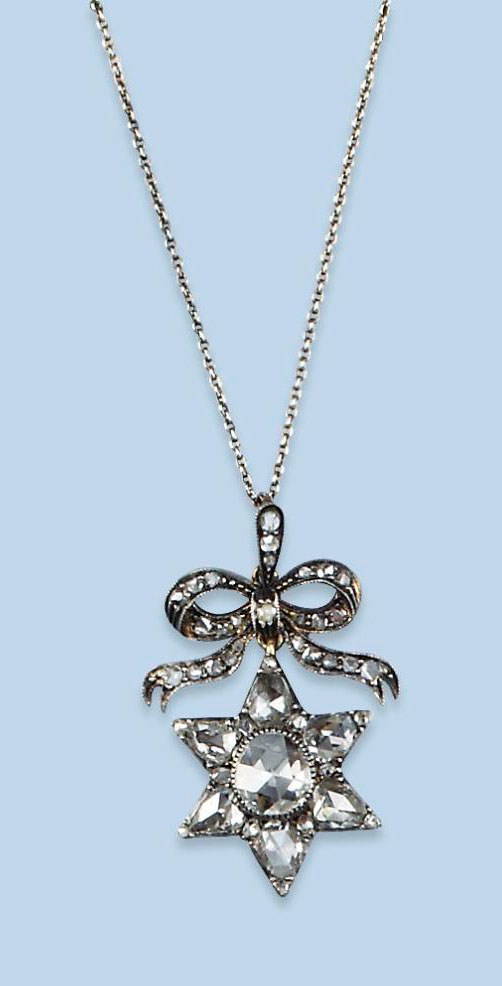 AN ANTIQUE DIAMOND PENDANT