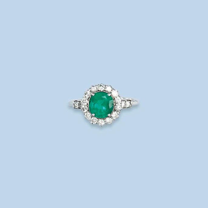 AN ART DECO EMERALD AND DIAMOND RING