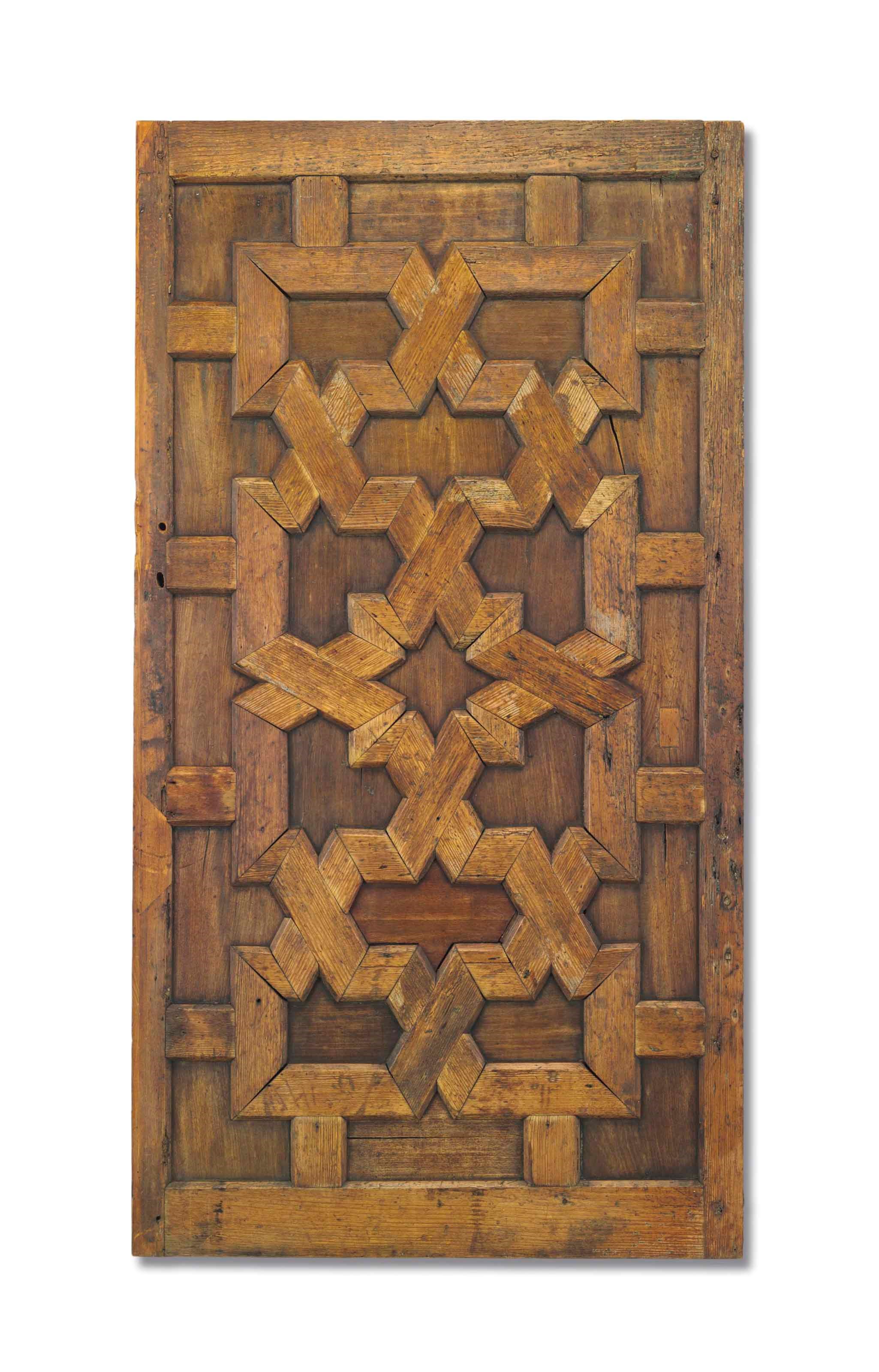 A HISPANO-MORESQUE WALNUT AND PINE ARCHITECTURAL PANEL