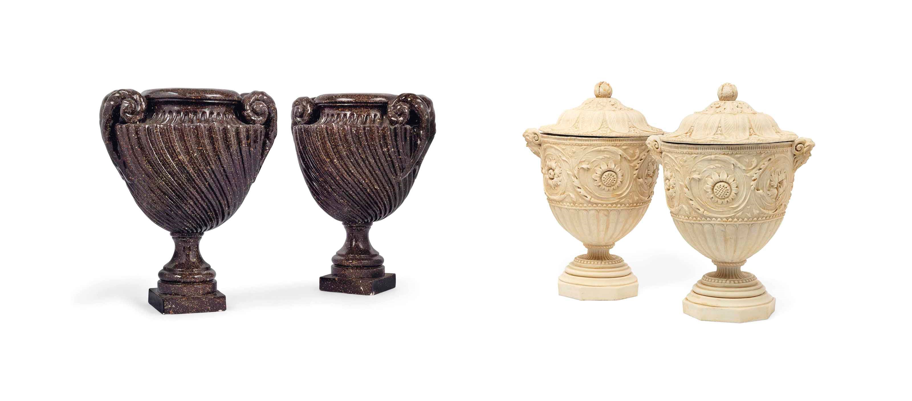 A PAIR OF COMPOSITION VASES AND COVERS