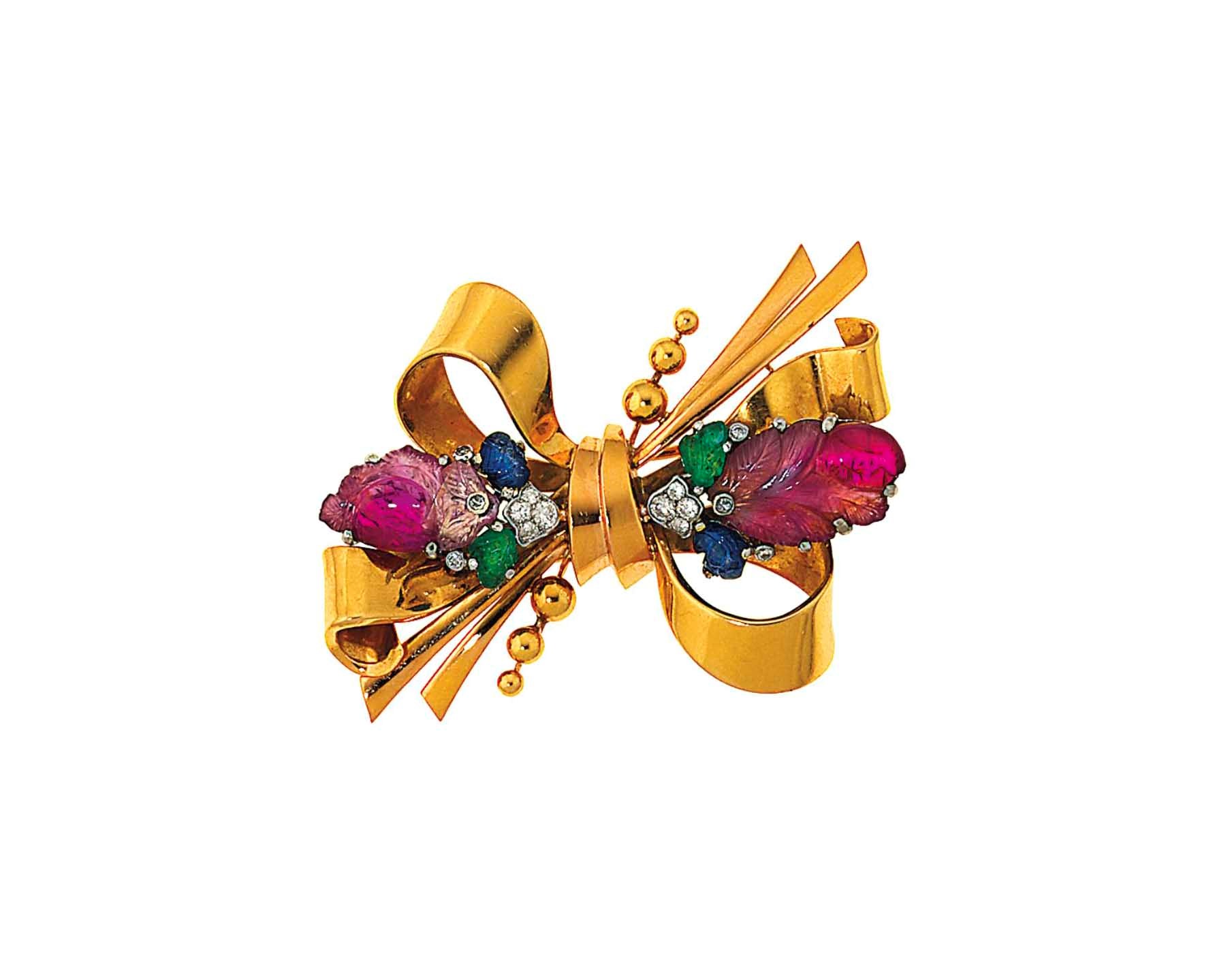 A diamond and gem-set brooch