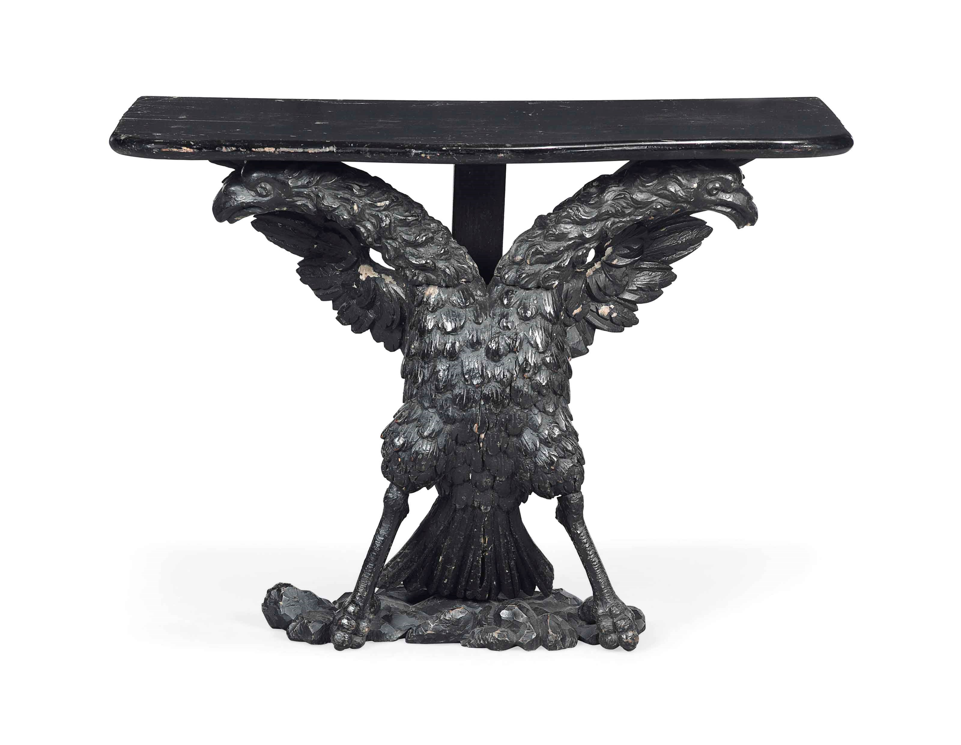 A CARVED BLACK PAINTED DOUBLE HEADED EAGLE CONSOLE TABLE