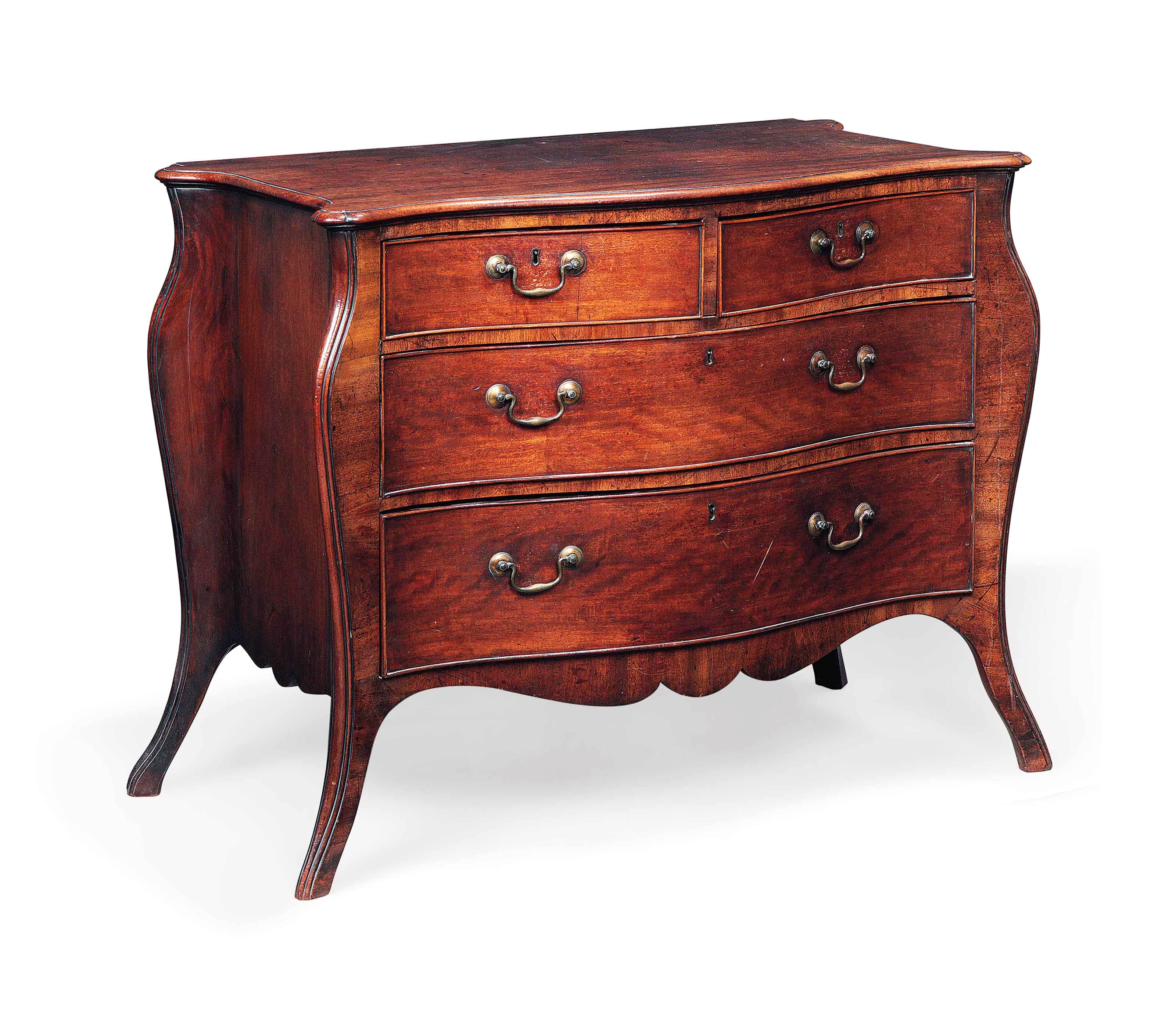 A MAHOGANY SERPENTINE COMMODE