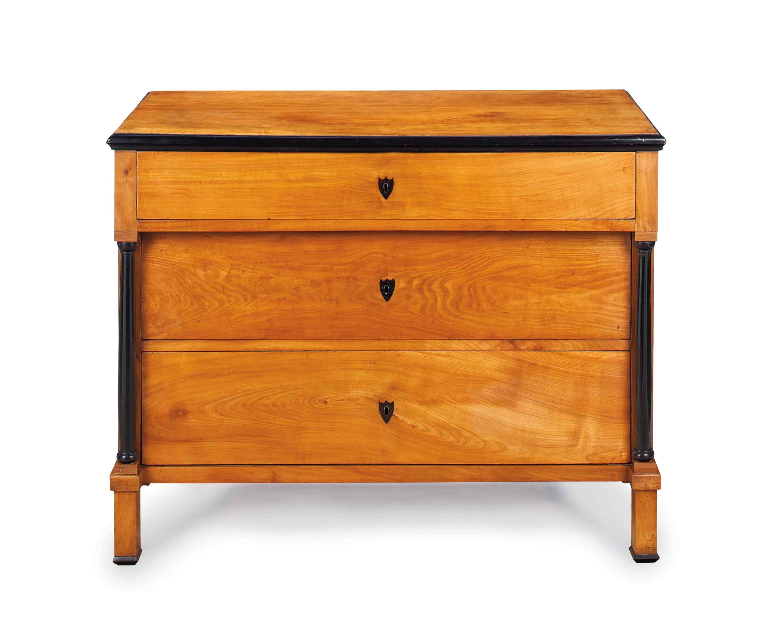 A BIEDERMIER MAPLE AND PARCEL-EBONIZED COMMODE,