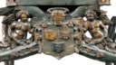 A RARE ITALIAN CARVED AND POLYCHROME DECORATED CHILD'S CARRIAGE