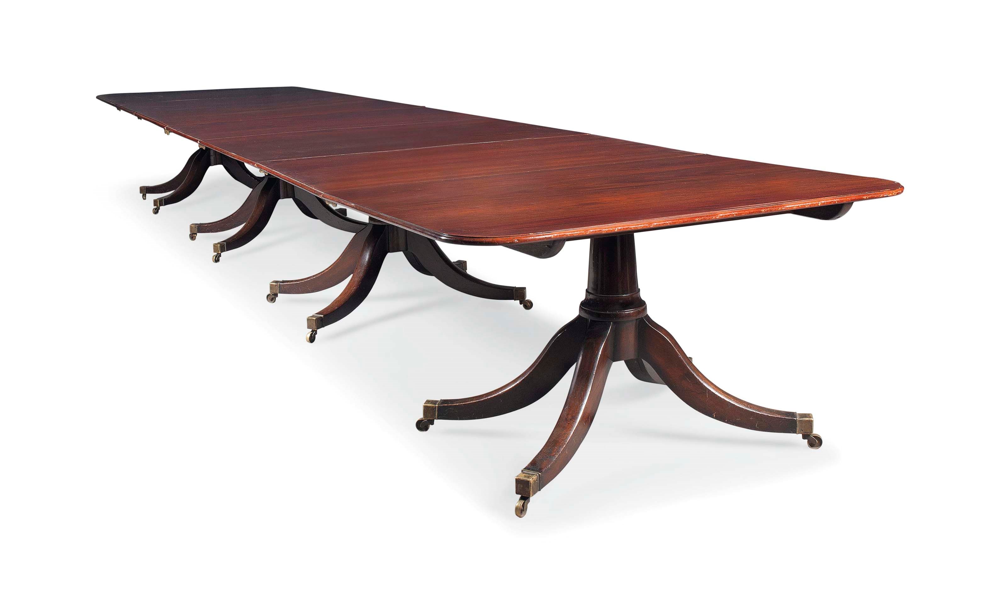 A LARGE MAHOGANY FOUR-PEDESTAL DINING TABLE