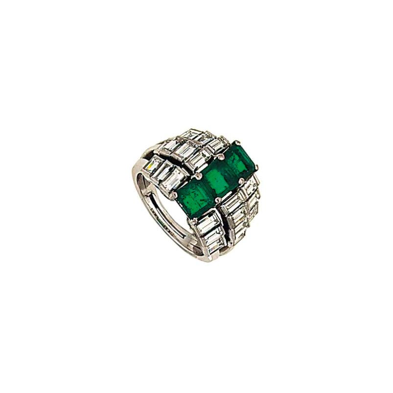 An emerald and diamond ring
