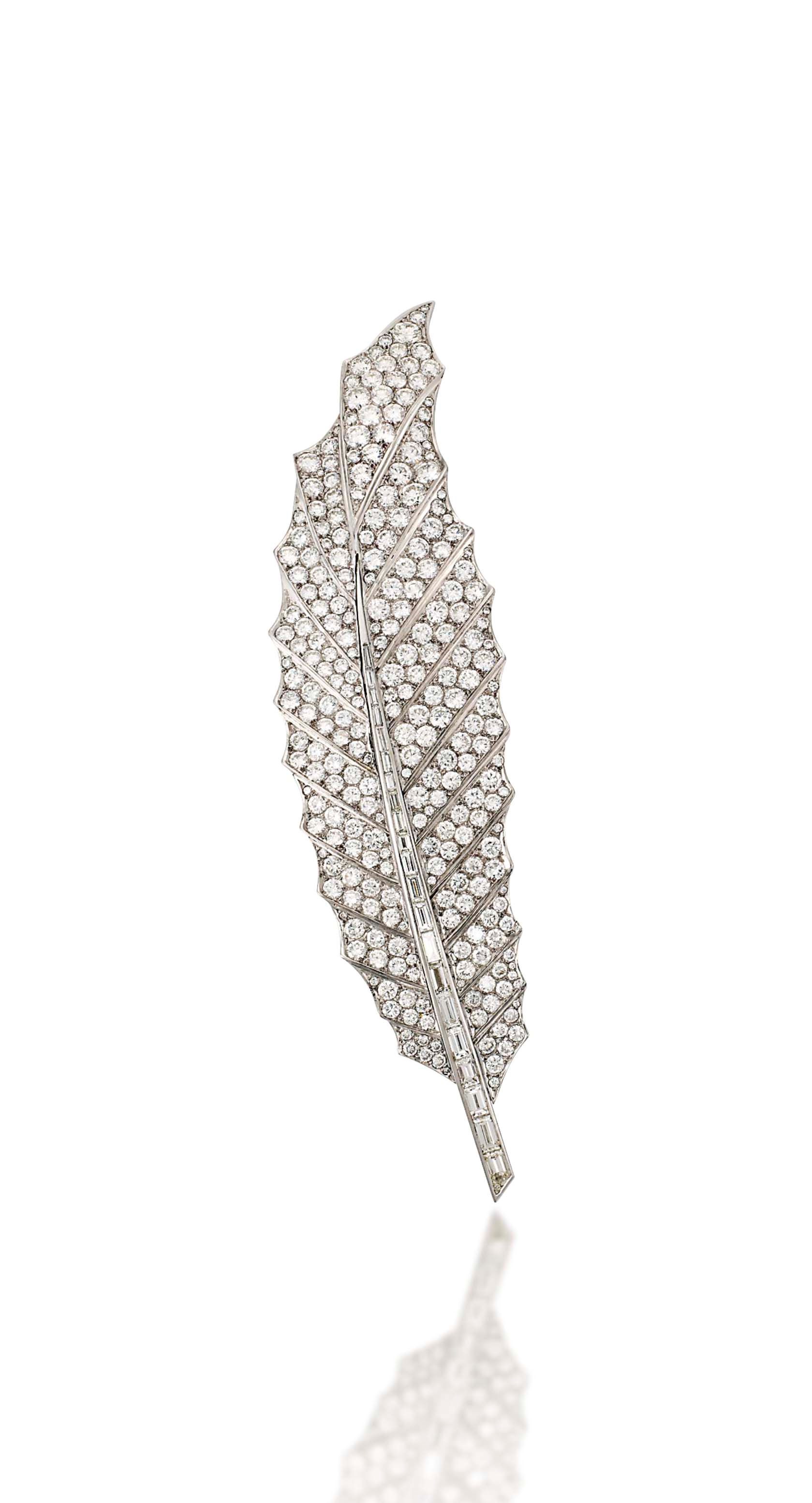 A DIAMOND FEATHER BROOCH