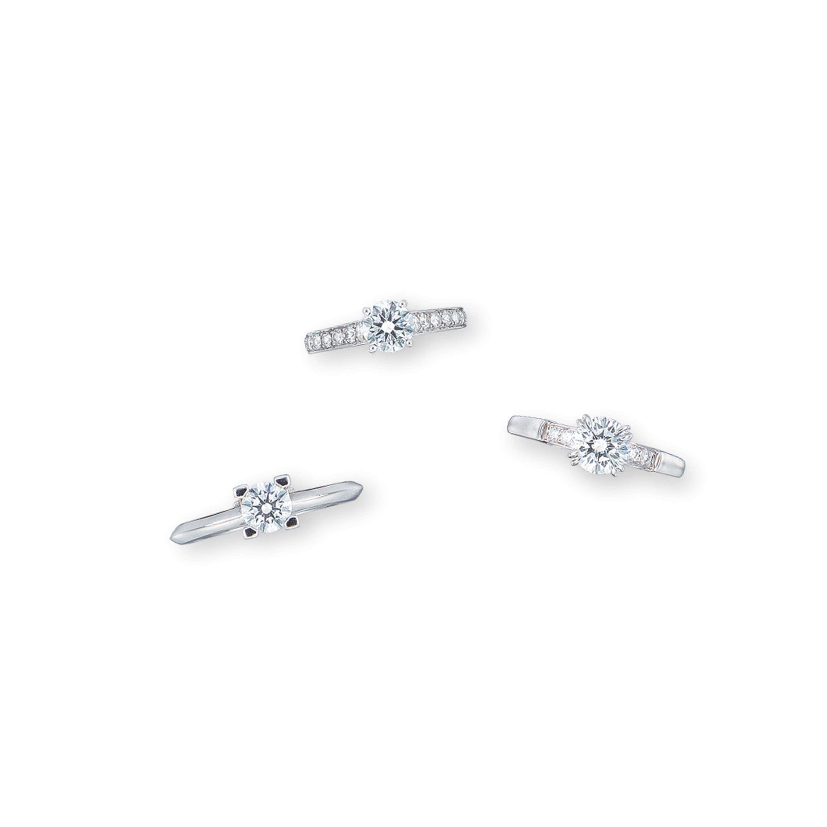 THREE SIGNED DIAMOND RINGS