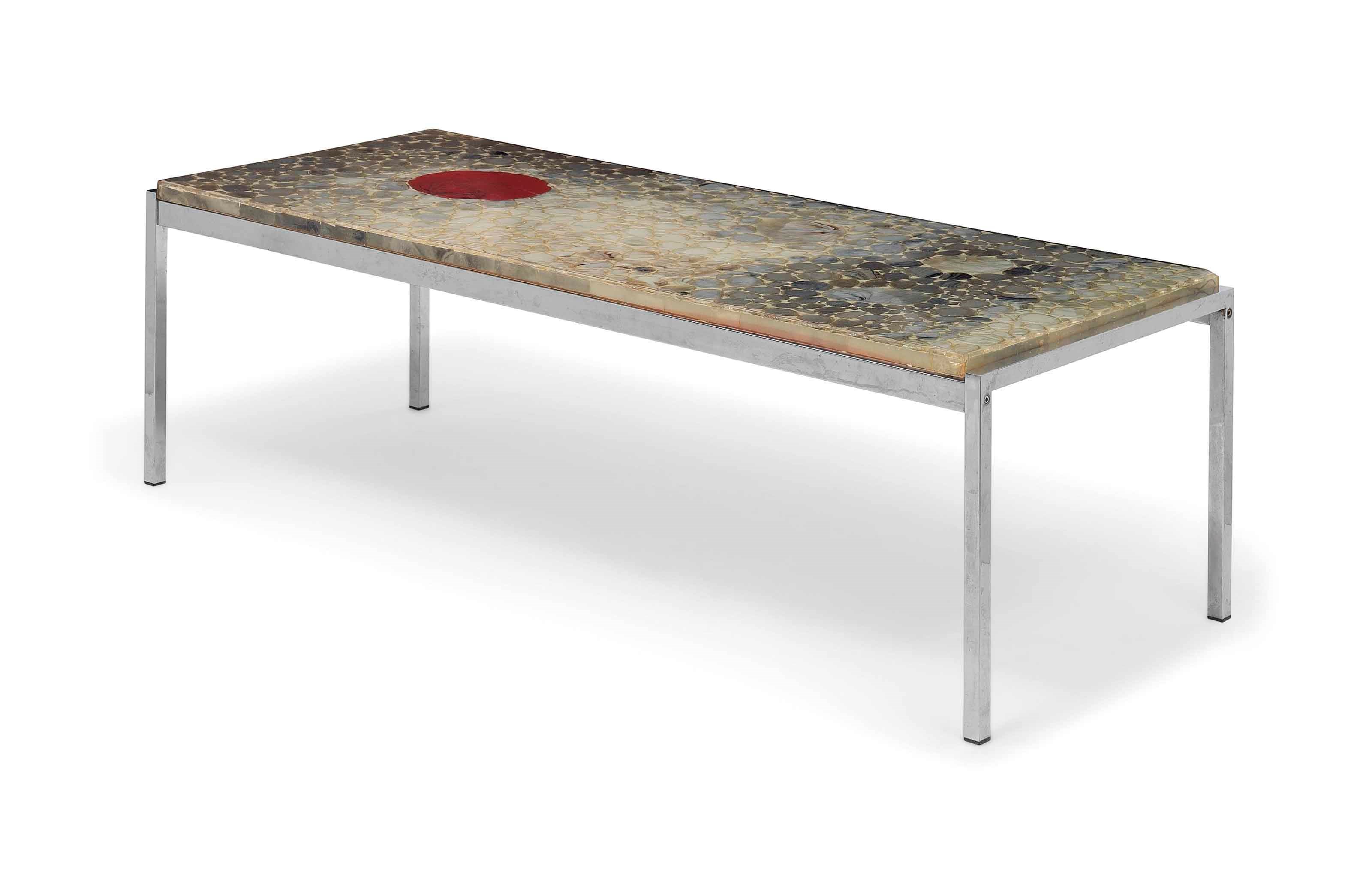 A CHROMED METAL COFFEE TABLE