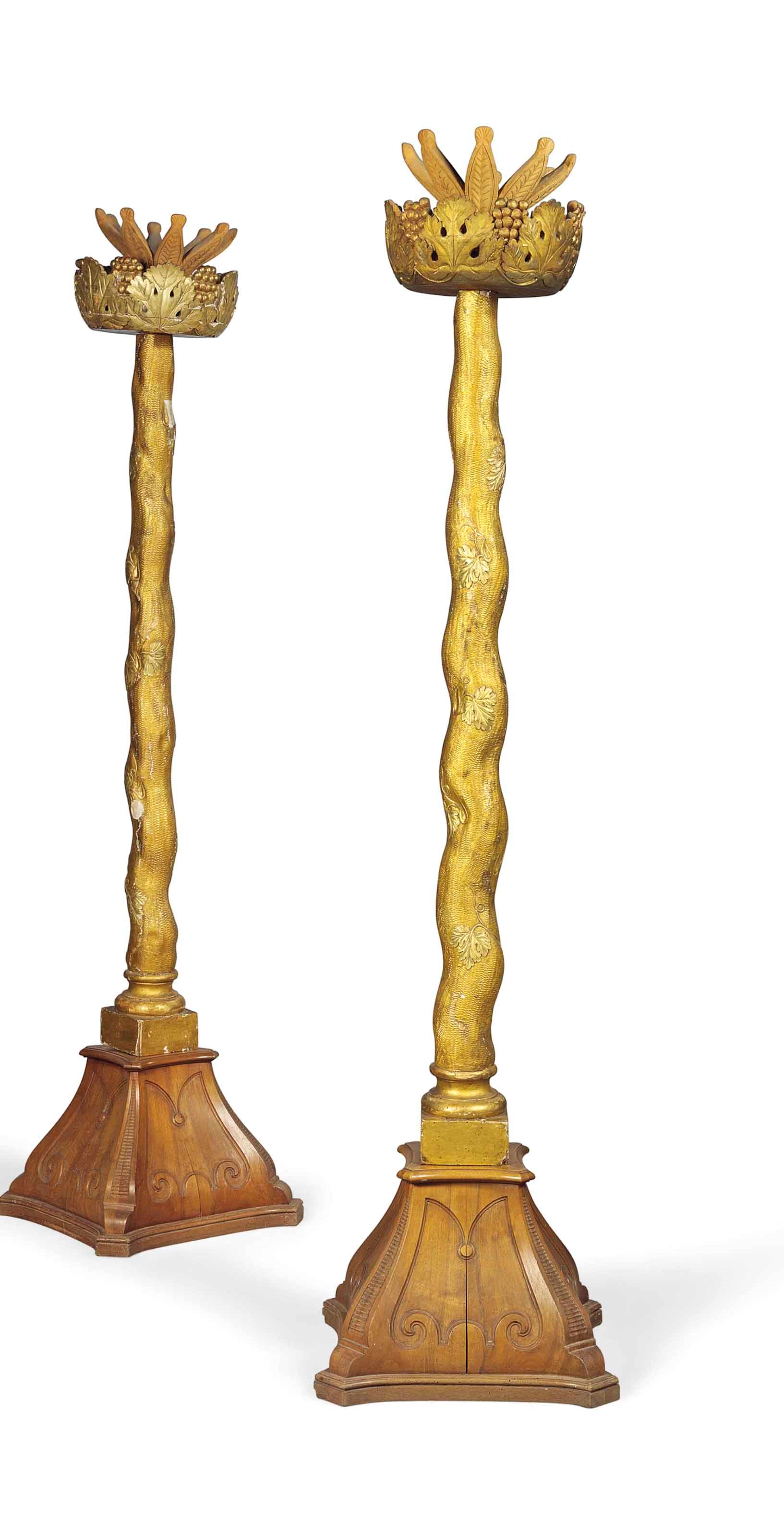 A PAIR OF WALNUT AND GILTWOOD TORCHERES