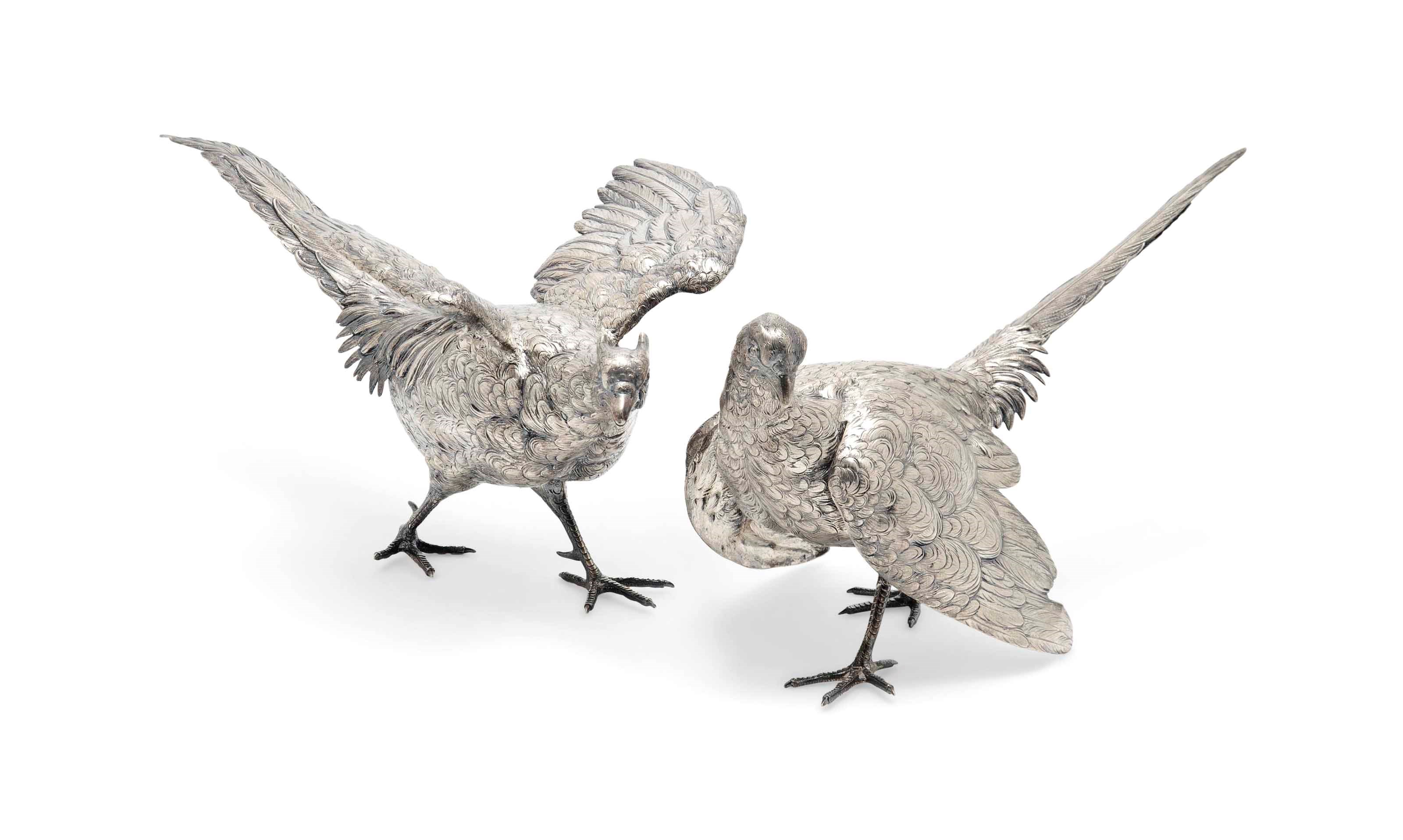 A LARGE PAIR OF GERMAN METALWARE PHEASANT TABLE ORNAMENTS