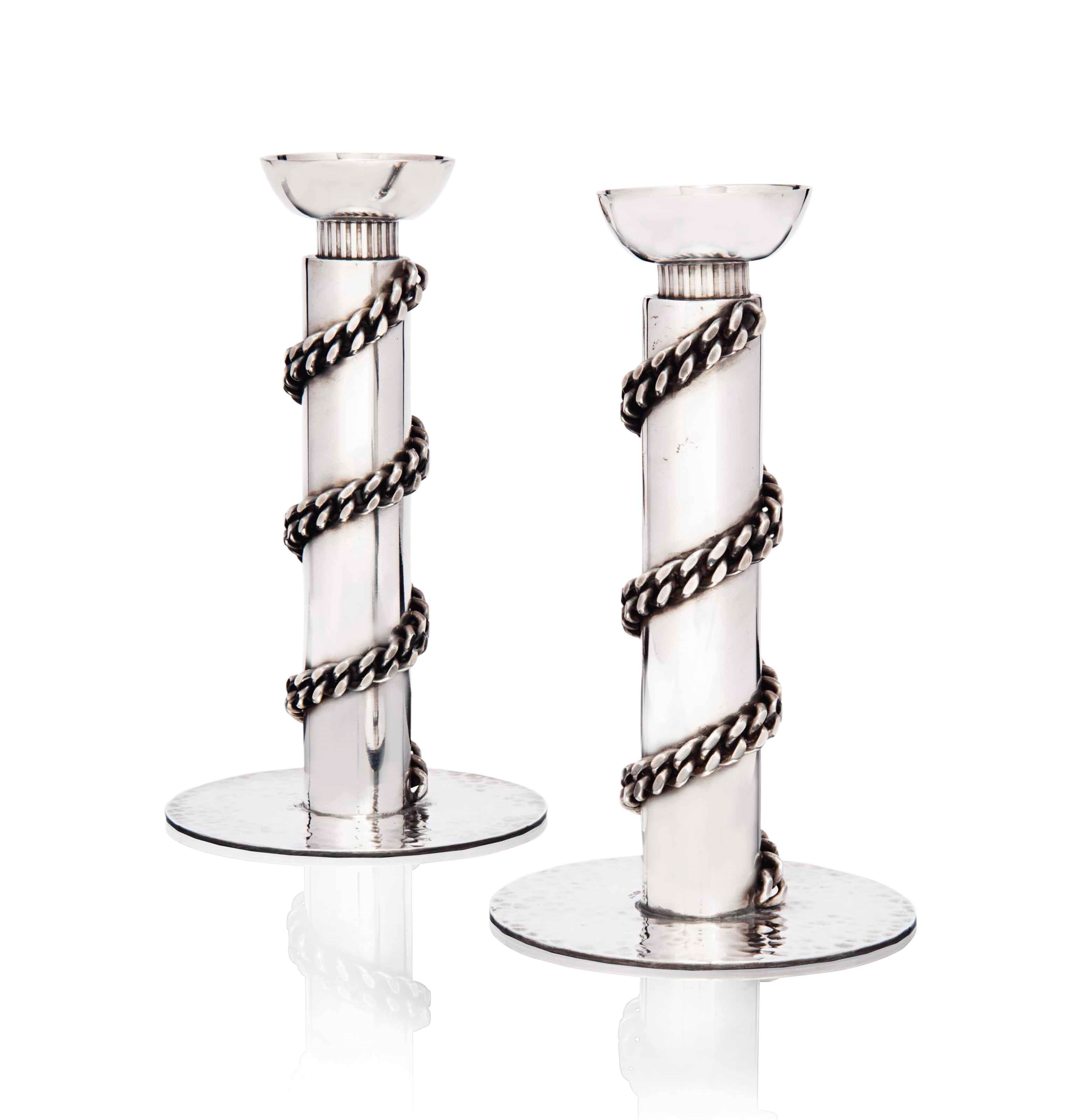 A PAIR OF JEAN DESPRÉS (1889-1980) SILVER-PLATED CANDLESTICKS