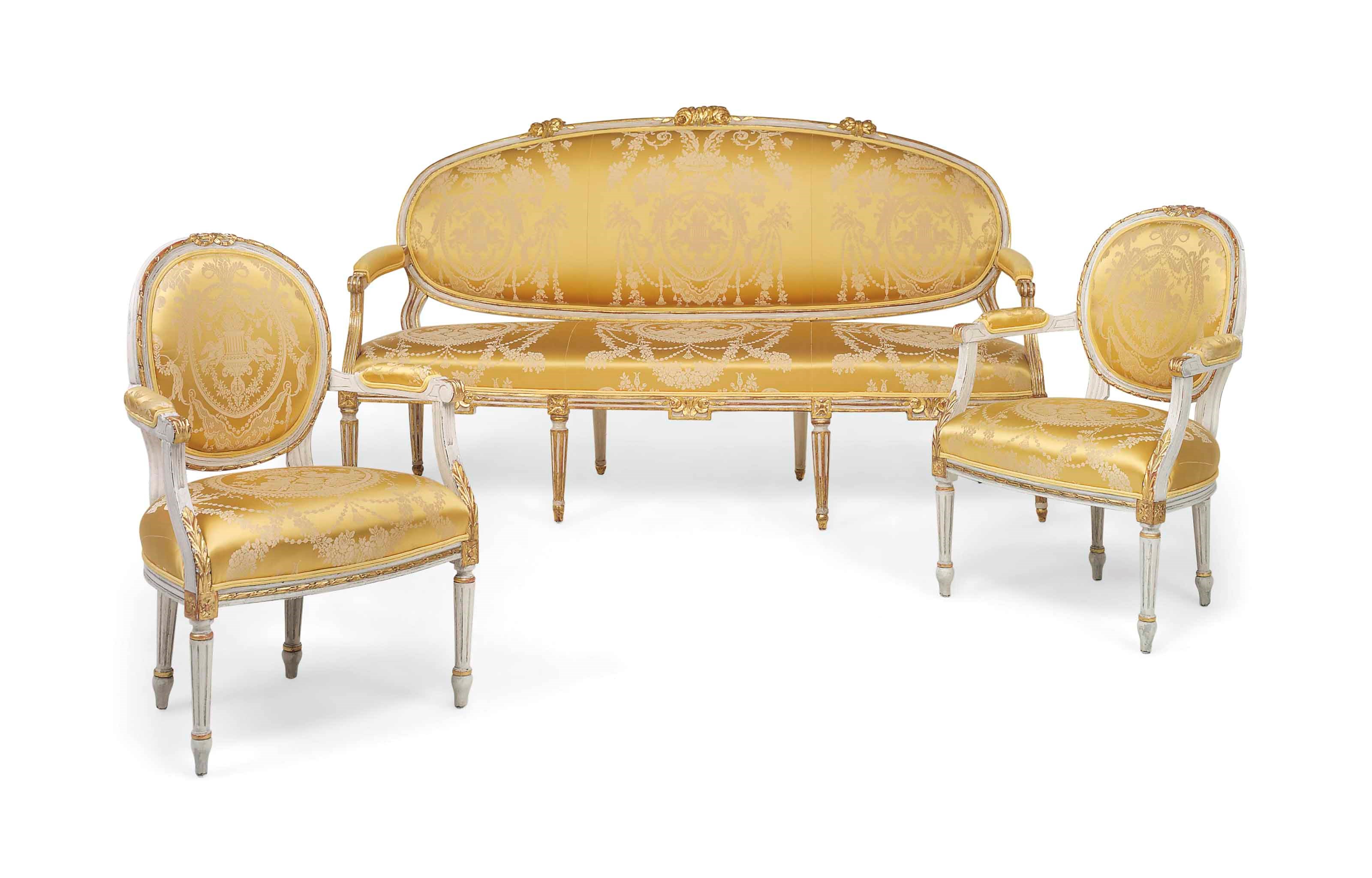 A SWEDISH PARCEL-GILT WHITE-PAINTED SOFA AND PAIR OF FAUTEUILS