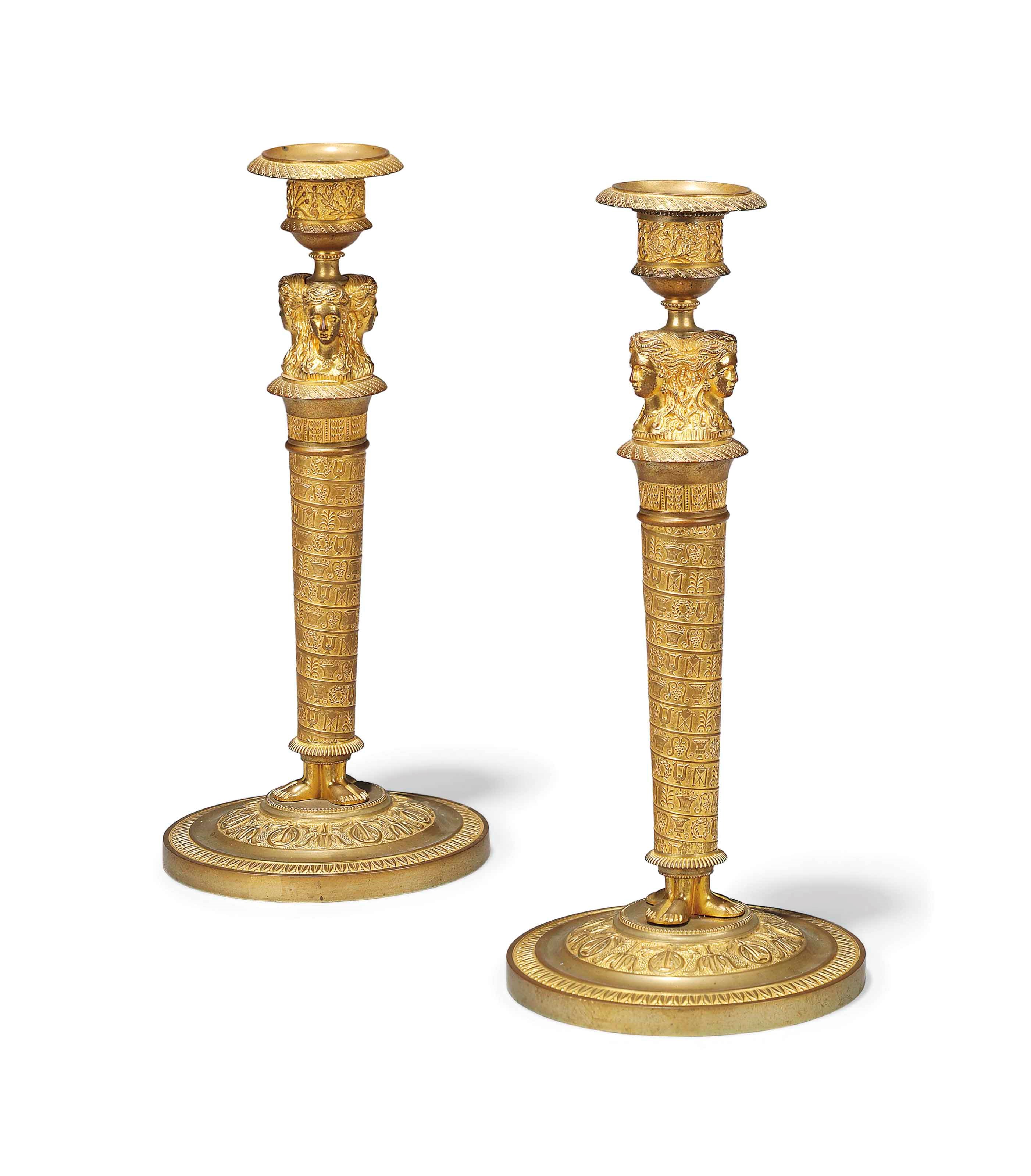 A PAIR OF FRENCH ORMOLU CANDLESTICKS