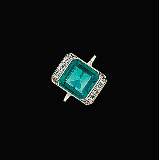 An early 20th century emerald and diamond ring