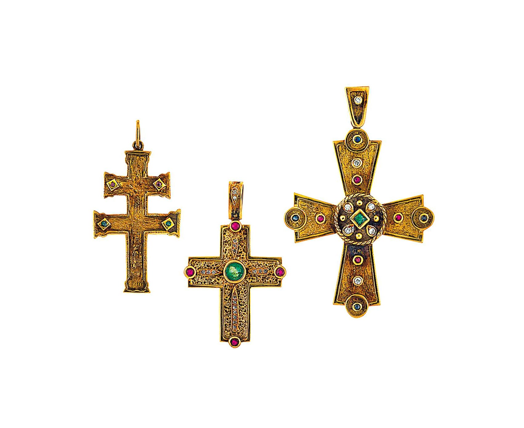 A coin necklace and three gem-set cross pendants