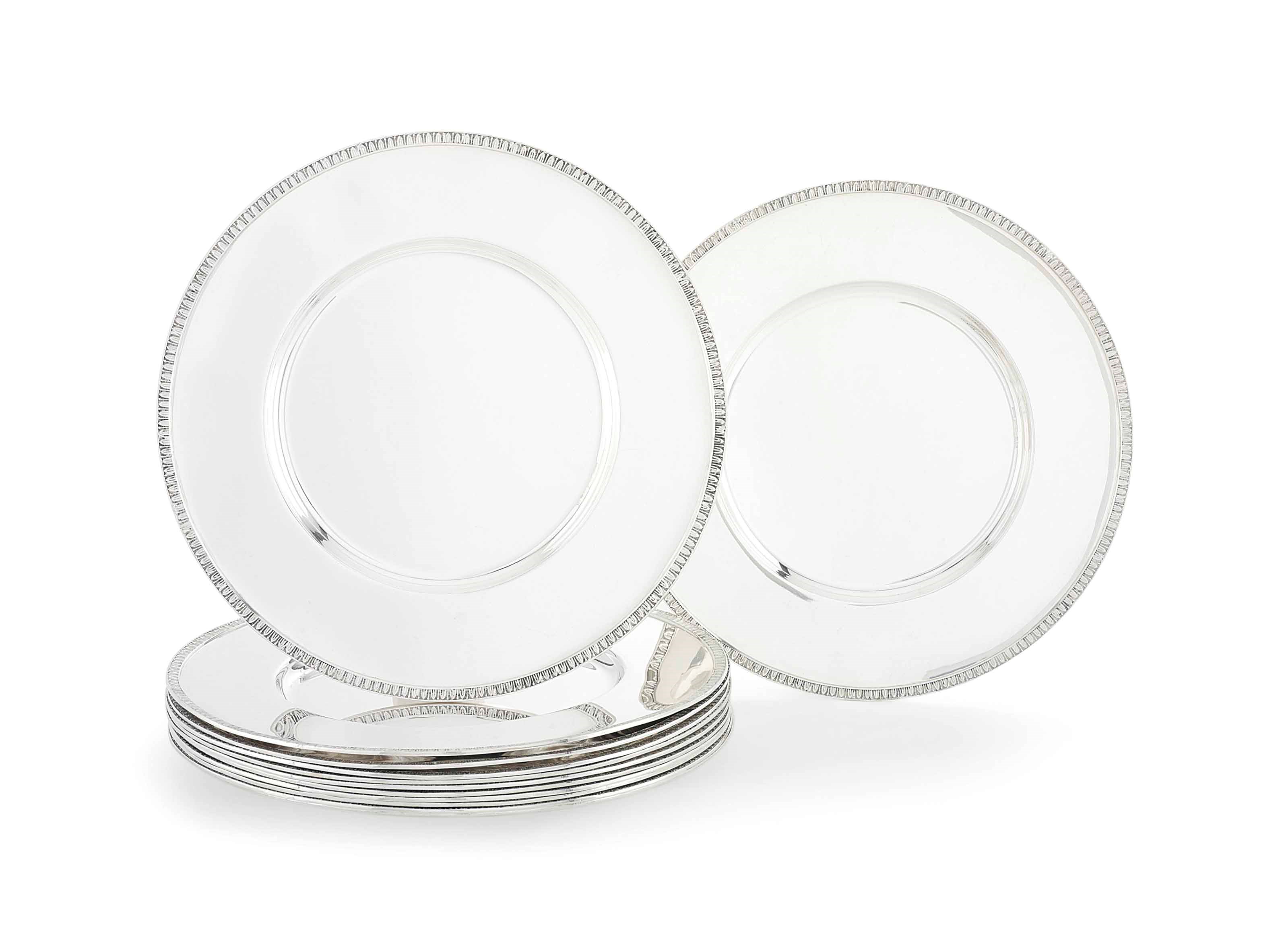 A SET OF TWELVE GREEK METALWARE UNDER-PLATES