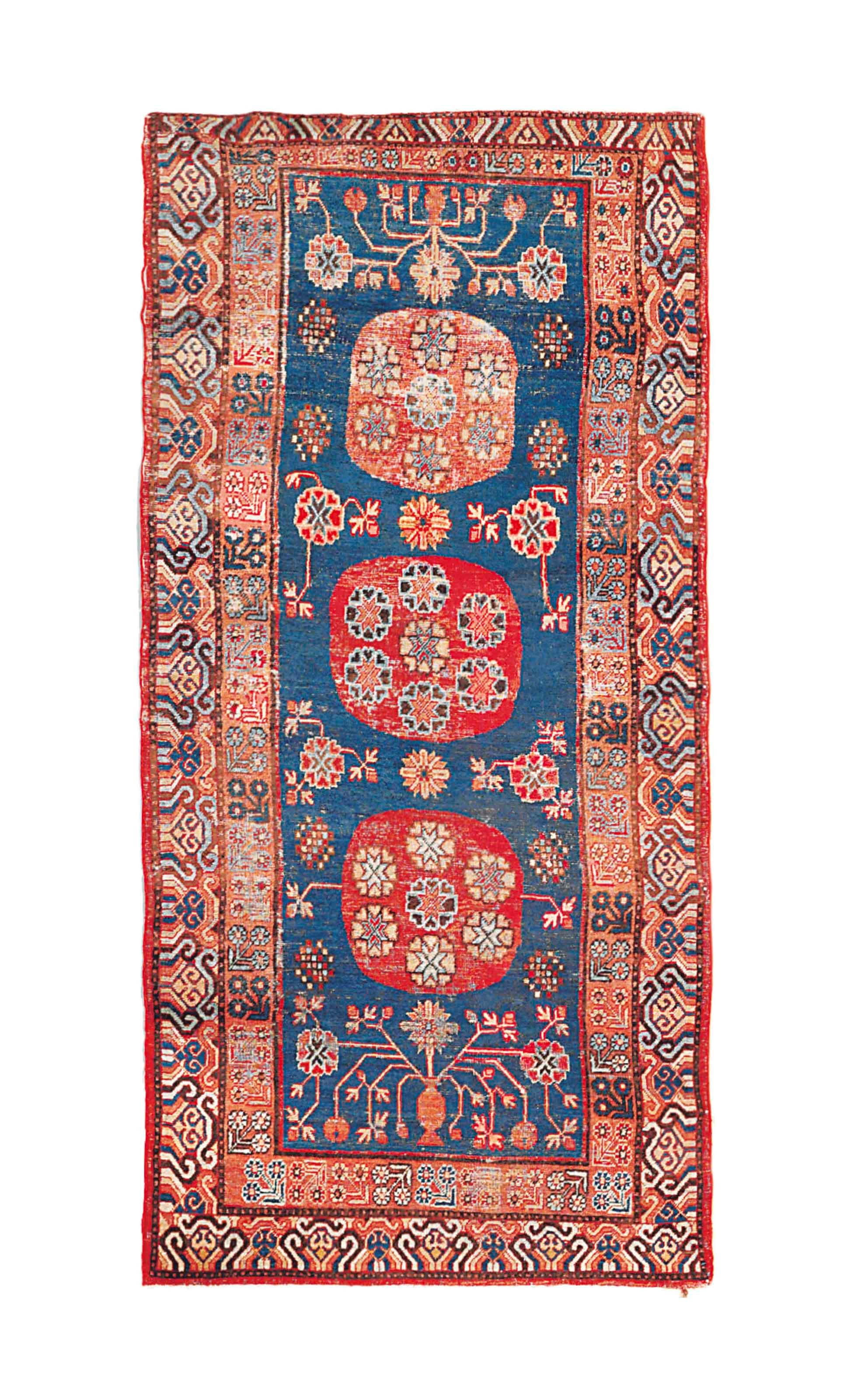 An antique Khotan rug