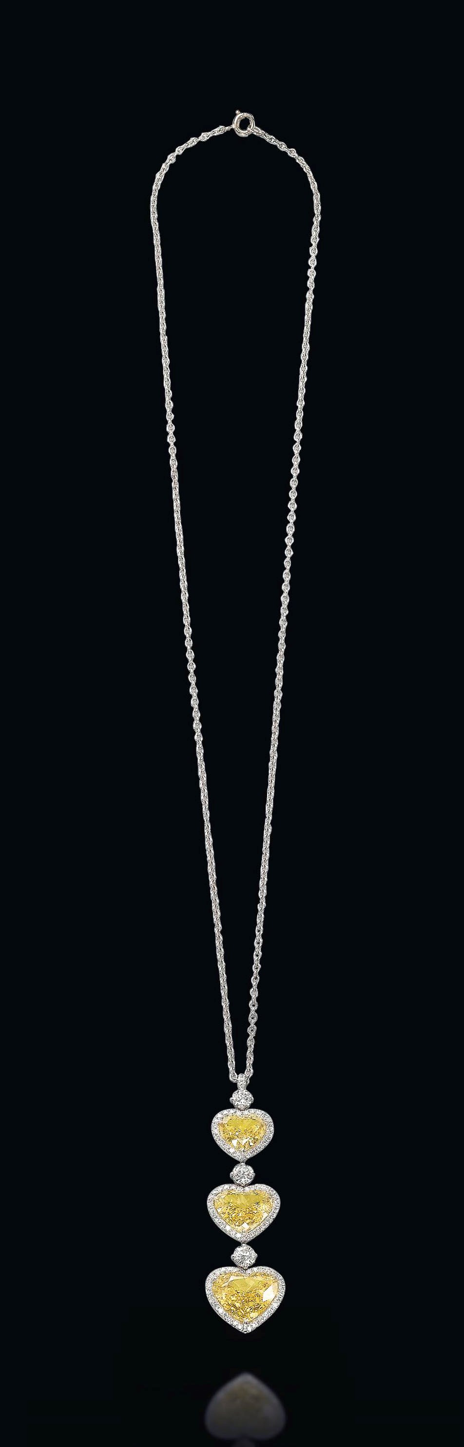 A COLOURED DIAMOND PENDANT