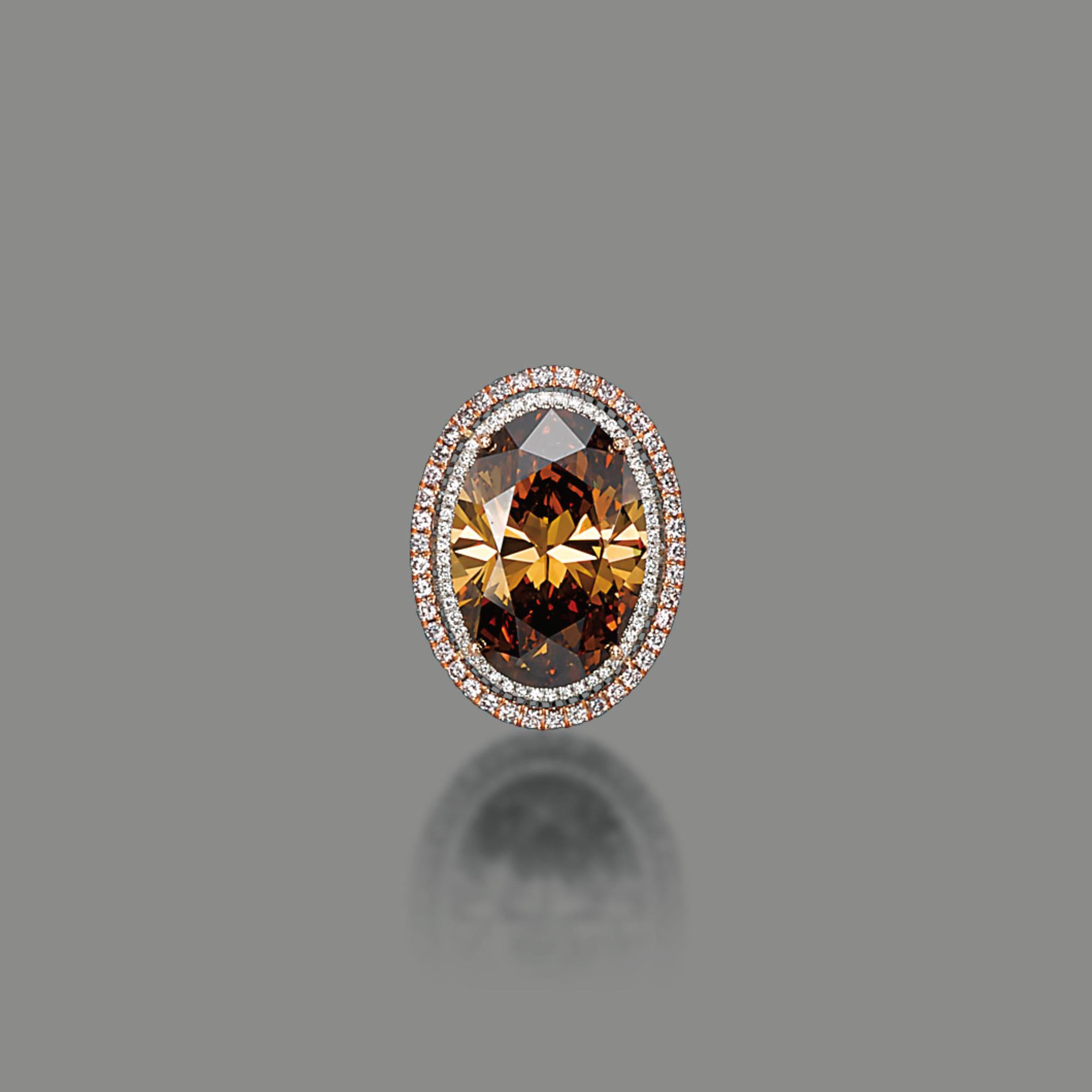 A COLOURED DIAMOND RING