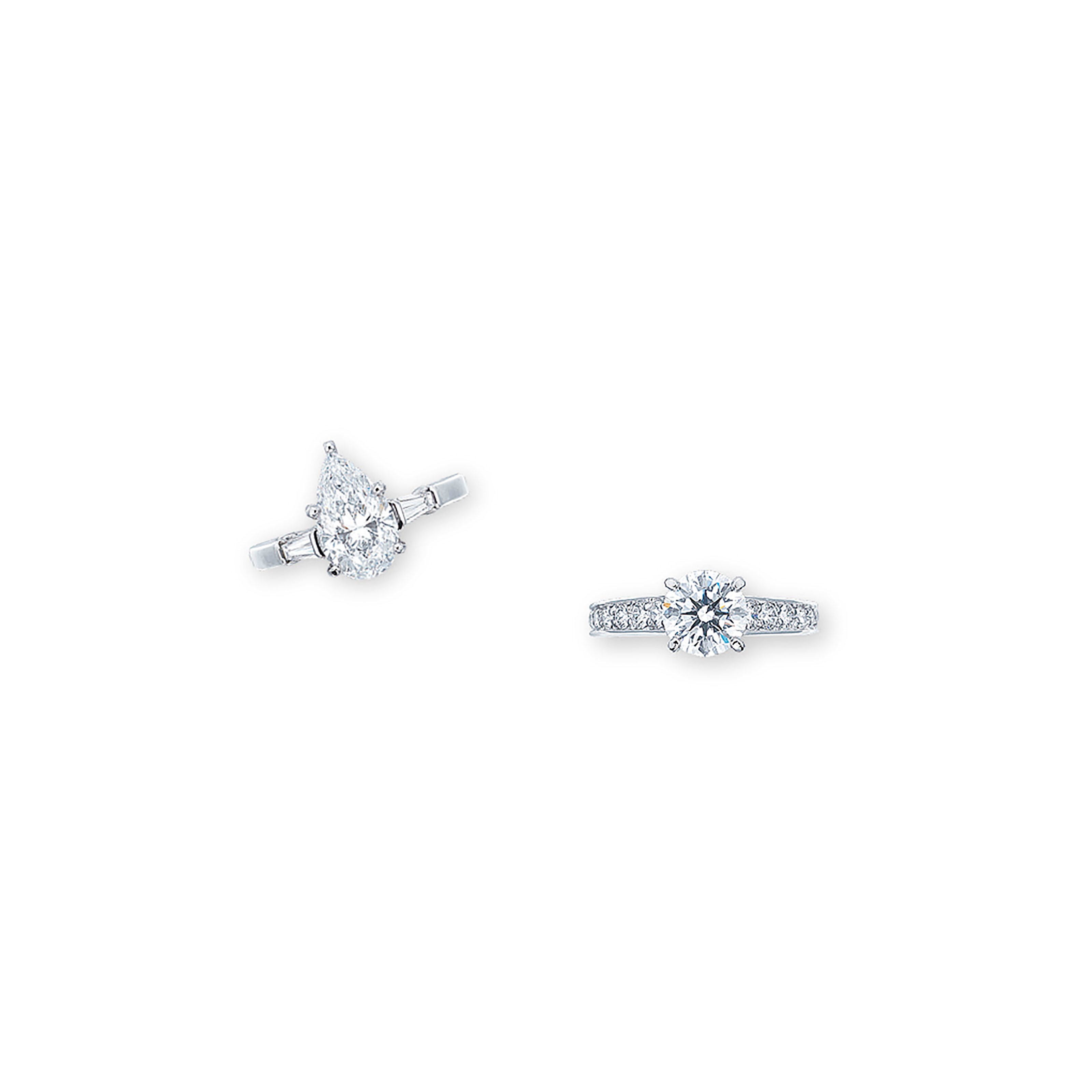TWO SIGNED DIAMOND RINGS