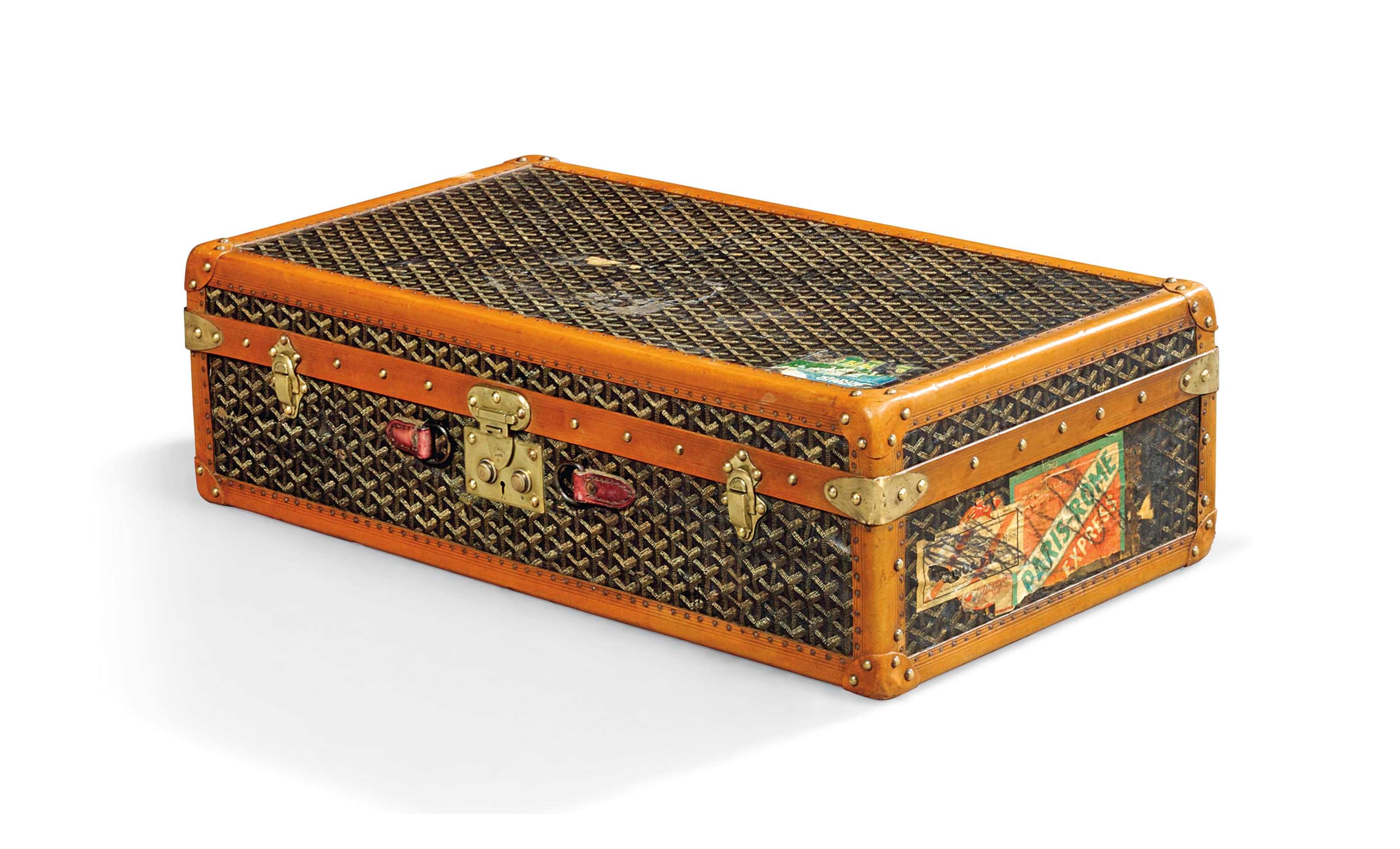 A SMALL TRUNK IN MONOGRAM CANVAS